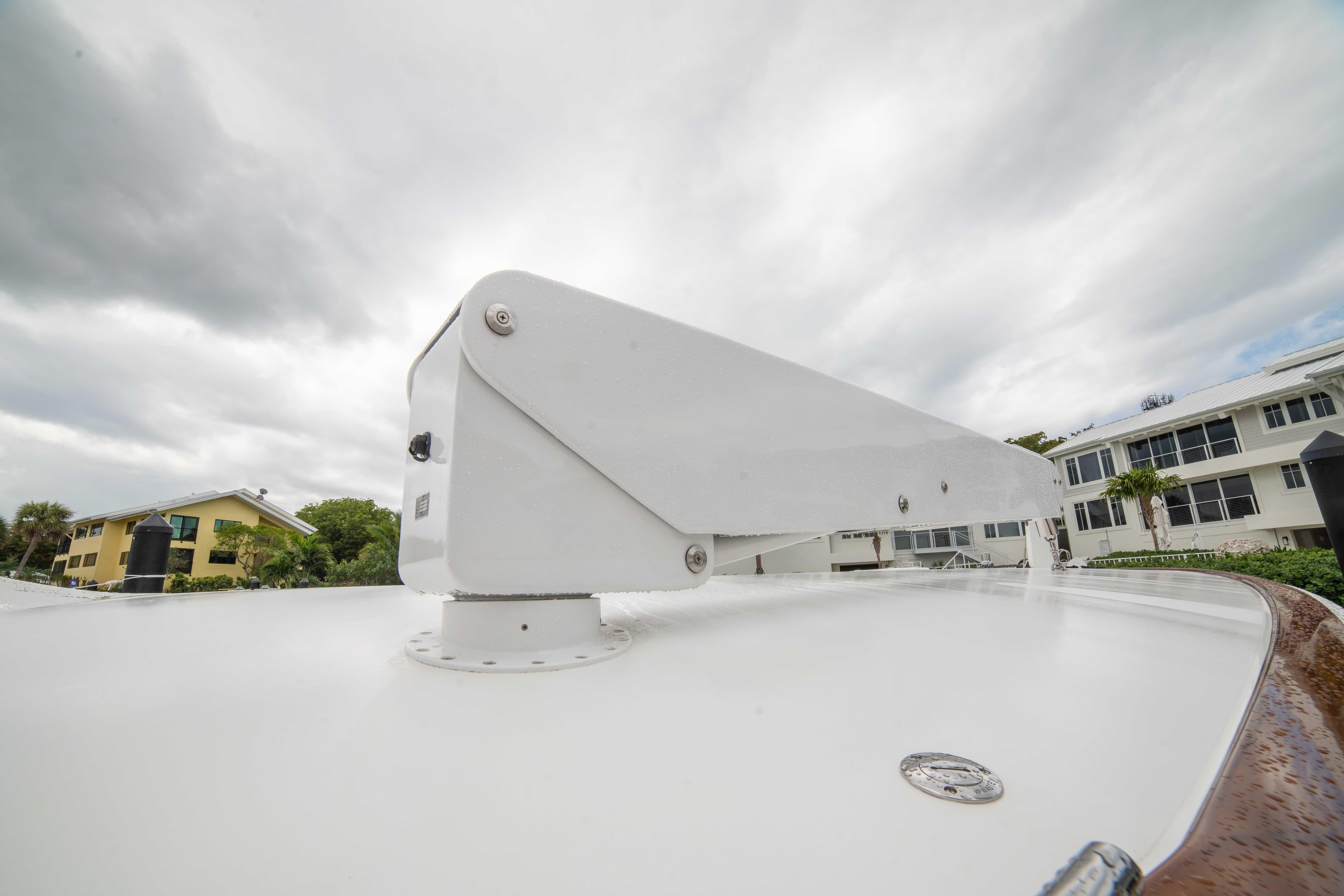 2019 Viking 72 Enclosed Bridge yacht detail with overcast sky background.