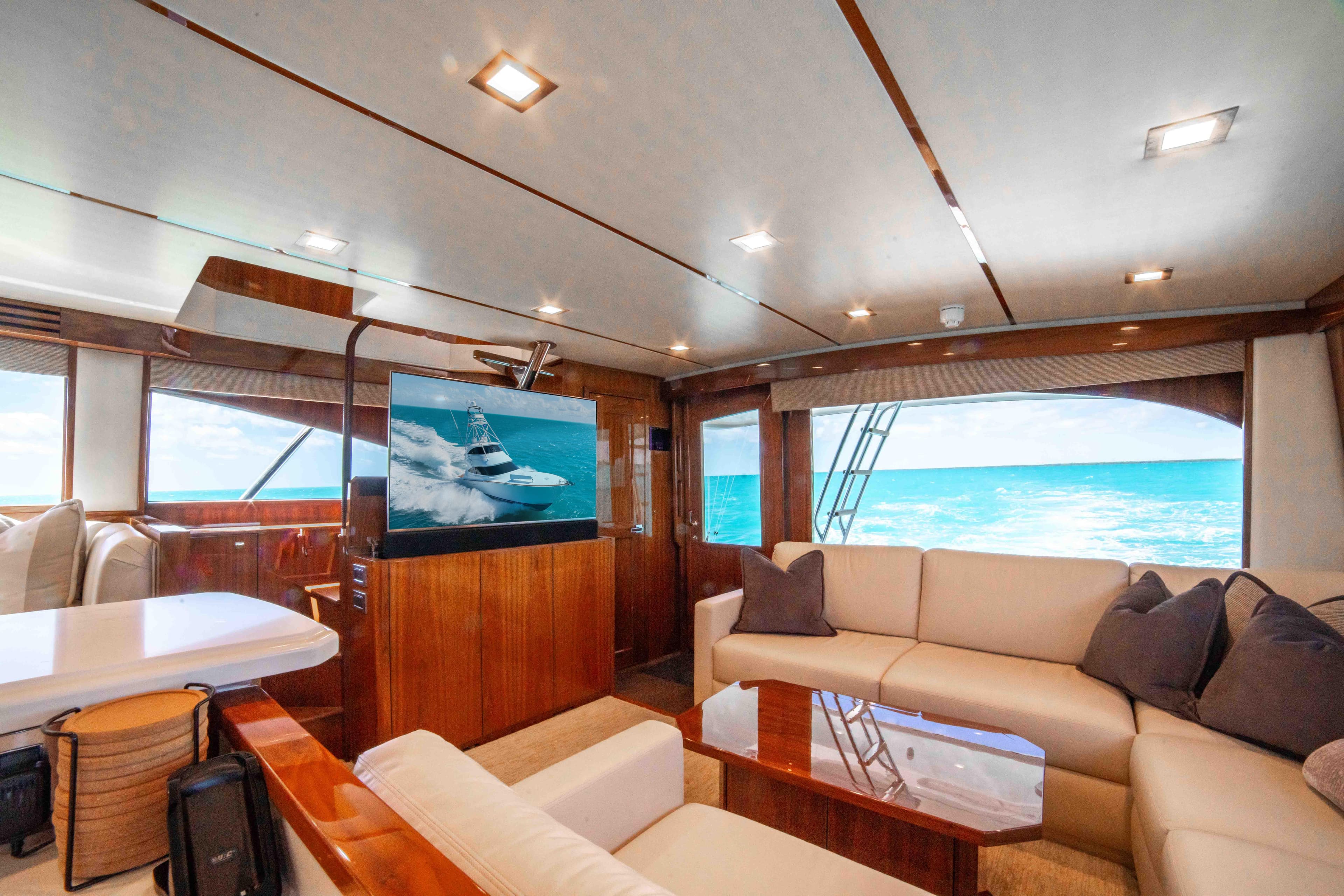 Luxurious interior of 2019 Viking 72 Enclosed Bridge yacht with ocean view.