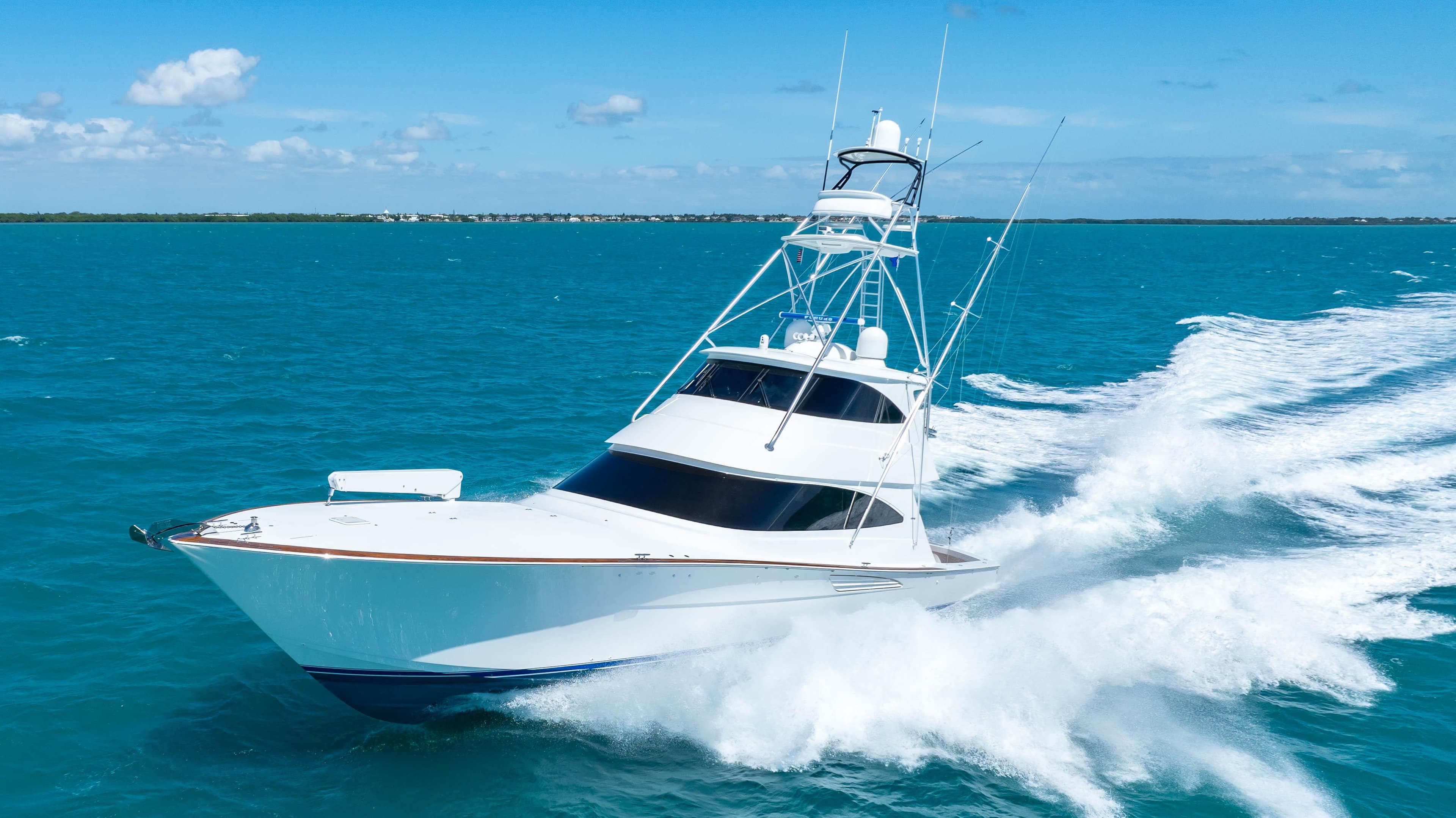 2019 Viking 72 Enclosed Bridge yacht cruising on open blue sea.