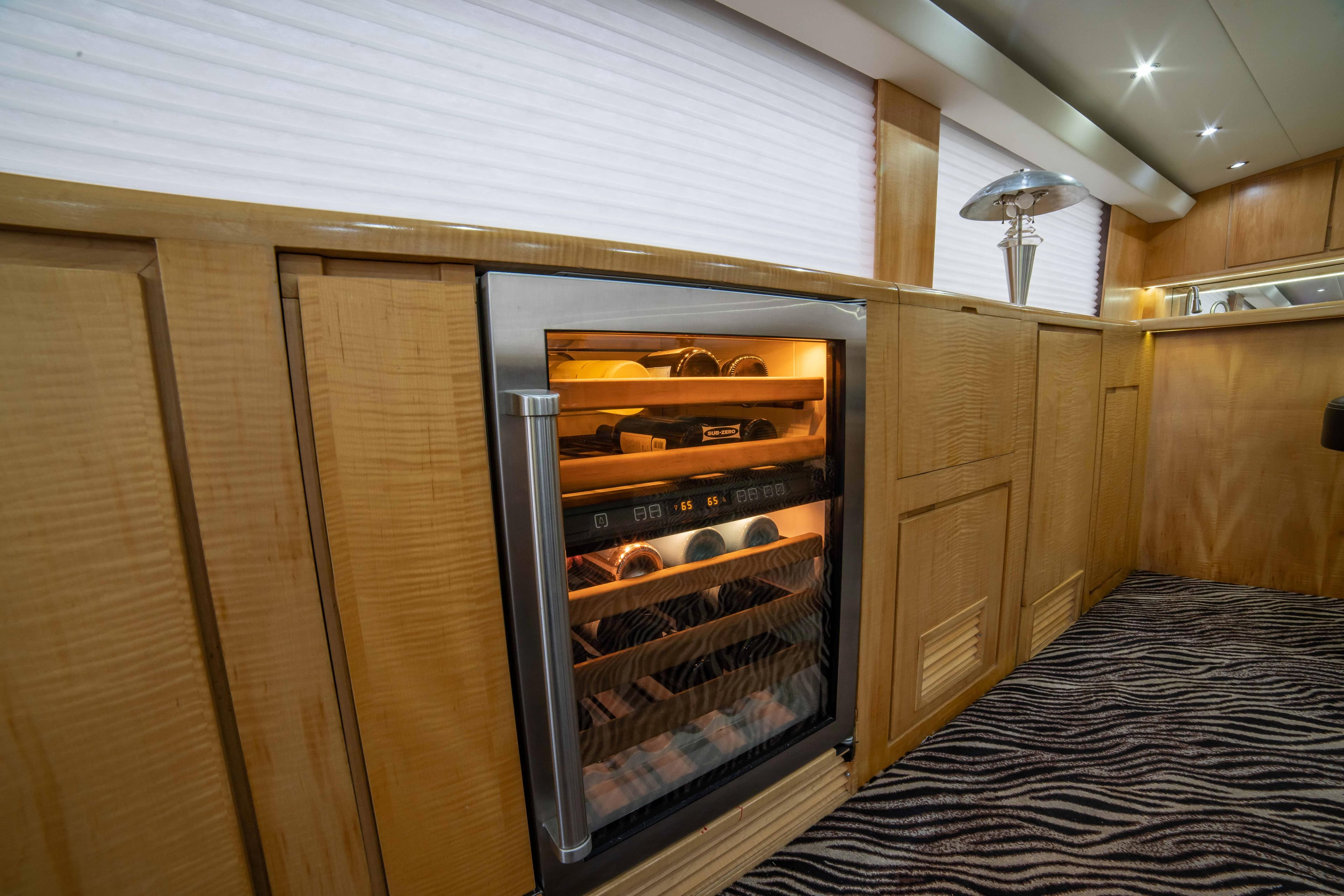 Wine cooler in the luxurious interior of a 1996 Donzi 72 Custom Convertible yacht.
