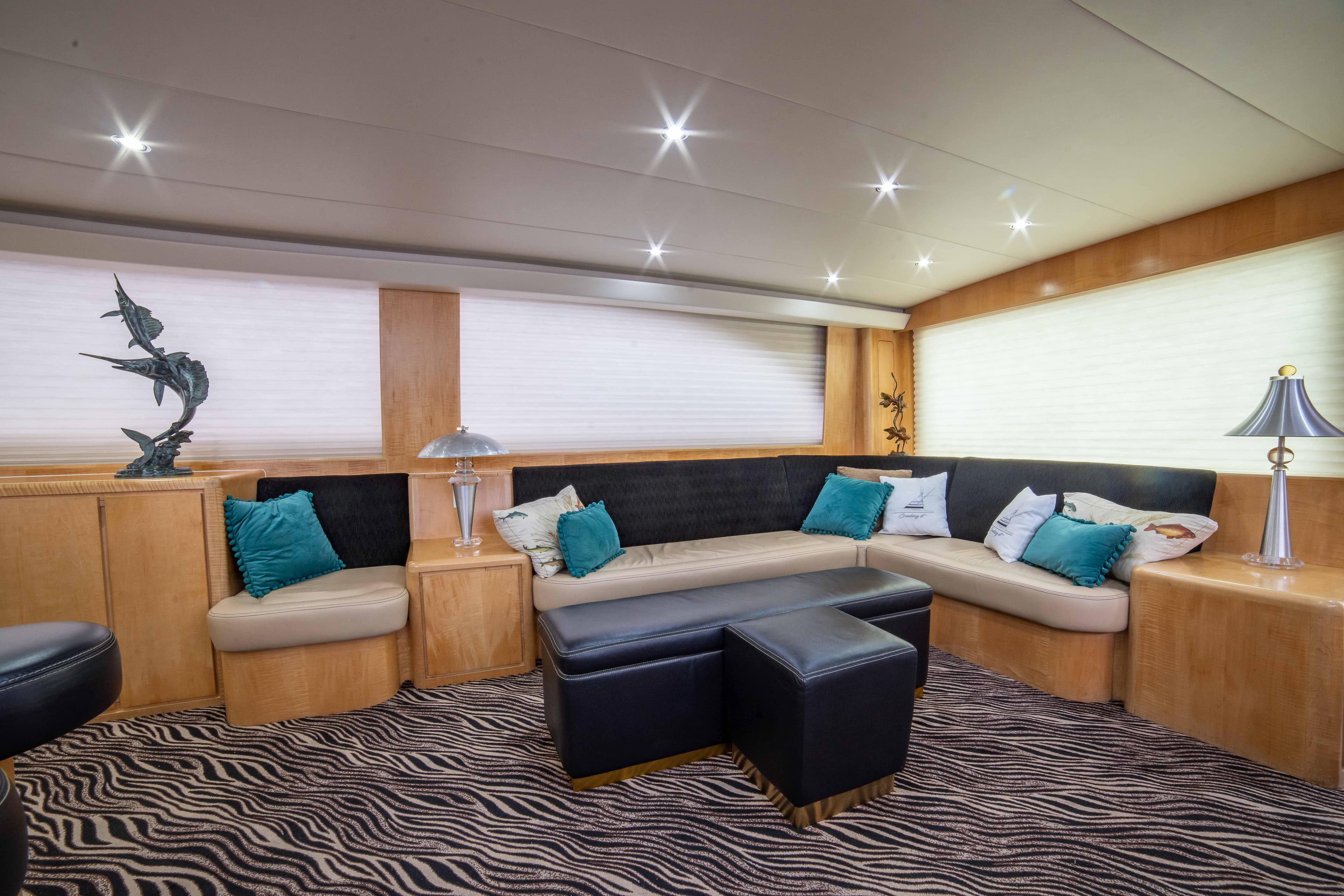 Luxurious interior of 1996 Donzi 72 Custom Convertible yacht with modern seating and decor.