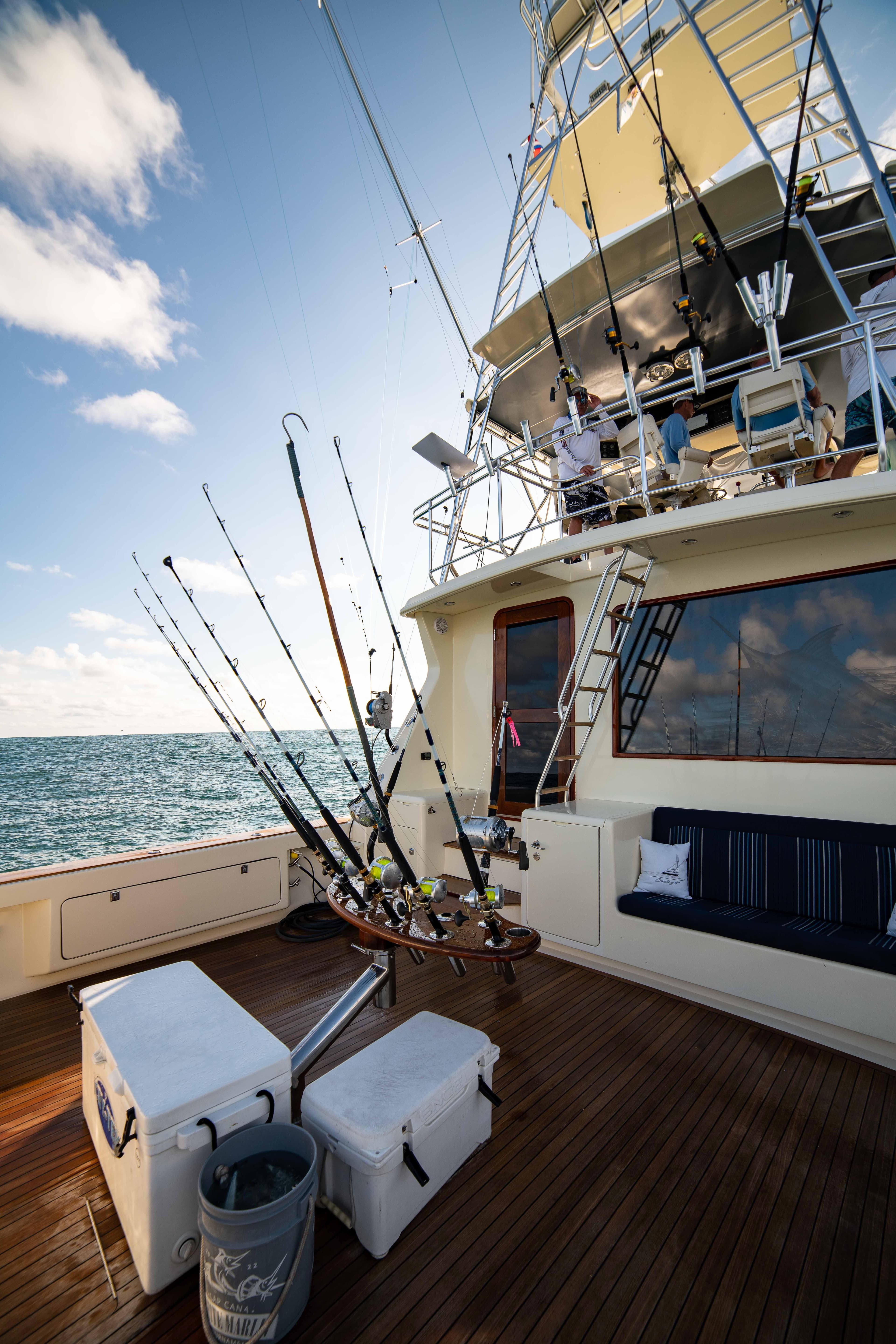 1996 Donzi 72 Custom Convertible yacht with fishing gear on deck.