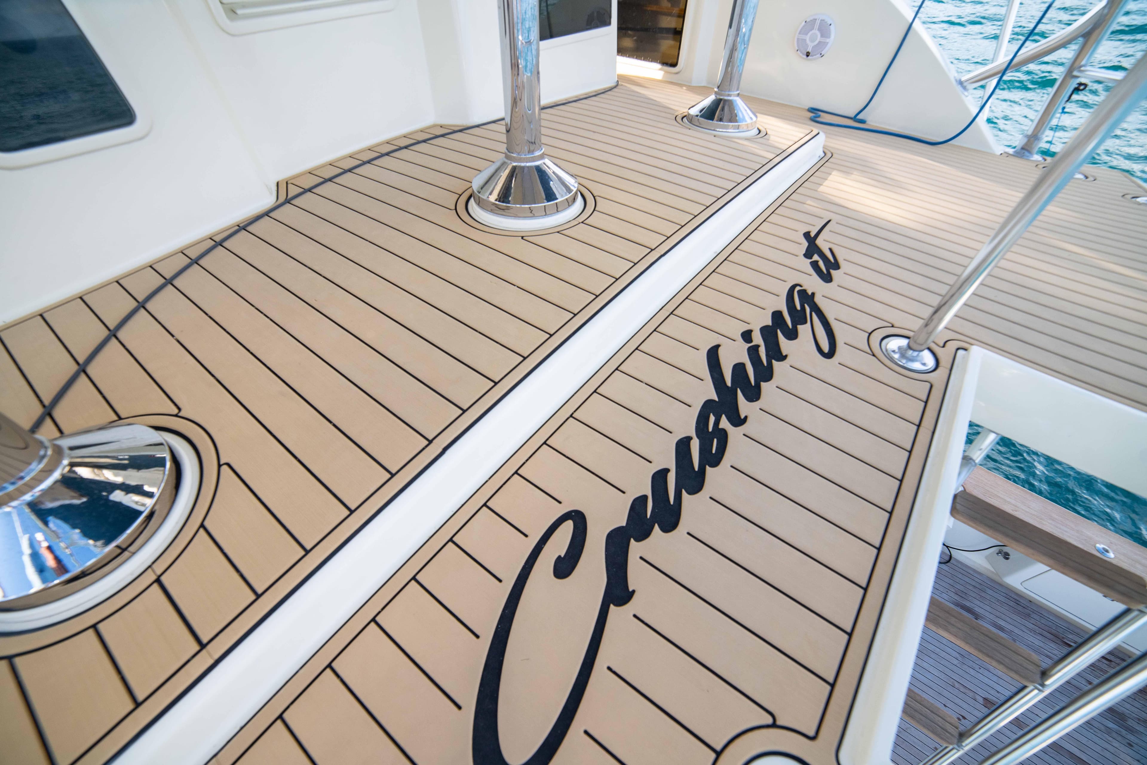 Donzi 72 Custom Convertible 1996 yacht deck with Crushing it text.