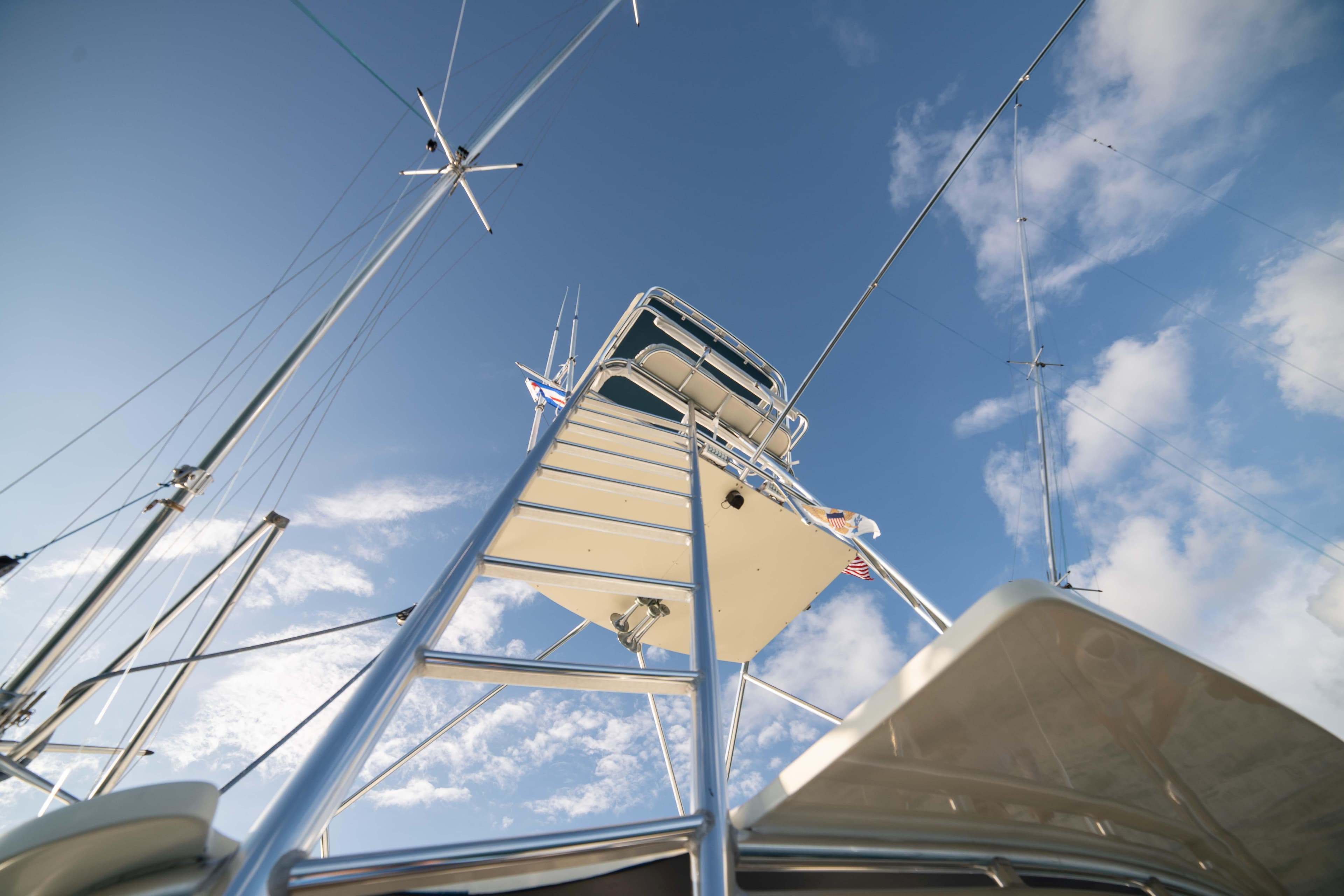 View of the 1996 Donzi 72 Custom Convertible yacht's tower against a blue sky.
