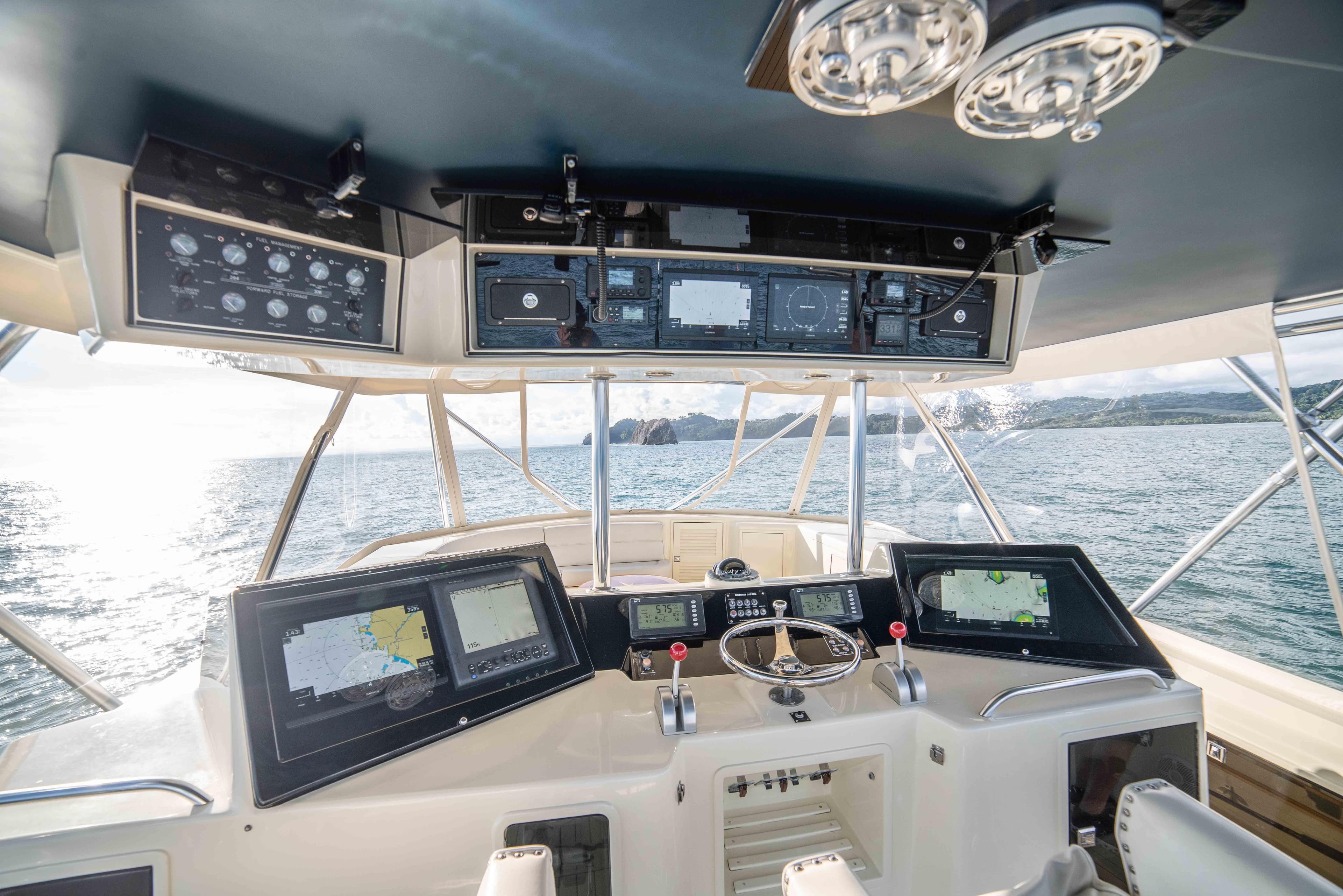 Cockpit of 1996 Donzi 72 Custom Convertible yacht with advanced navigation systems.