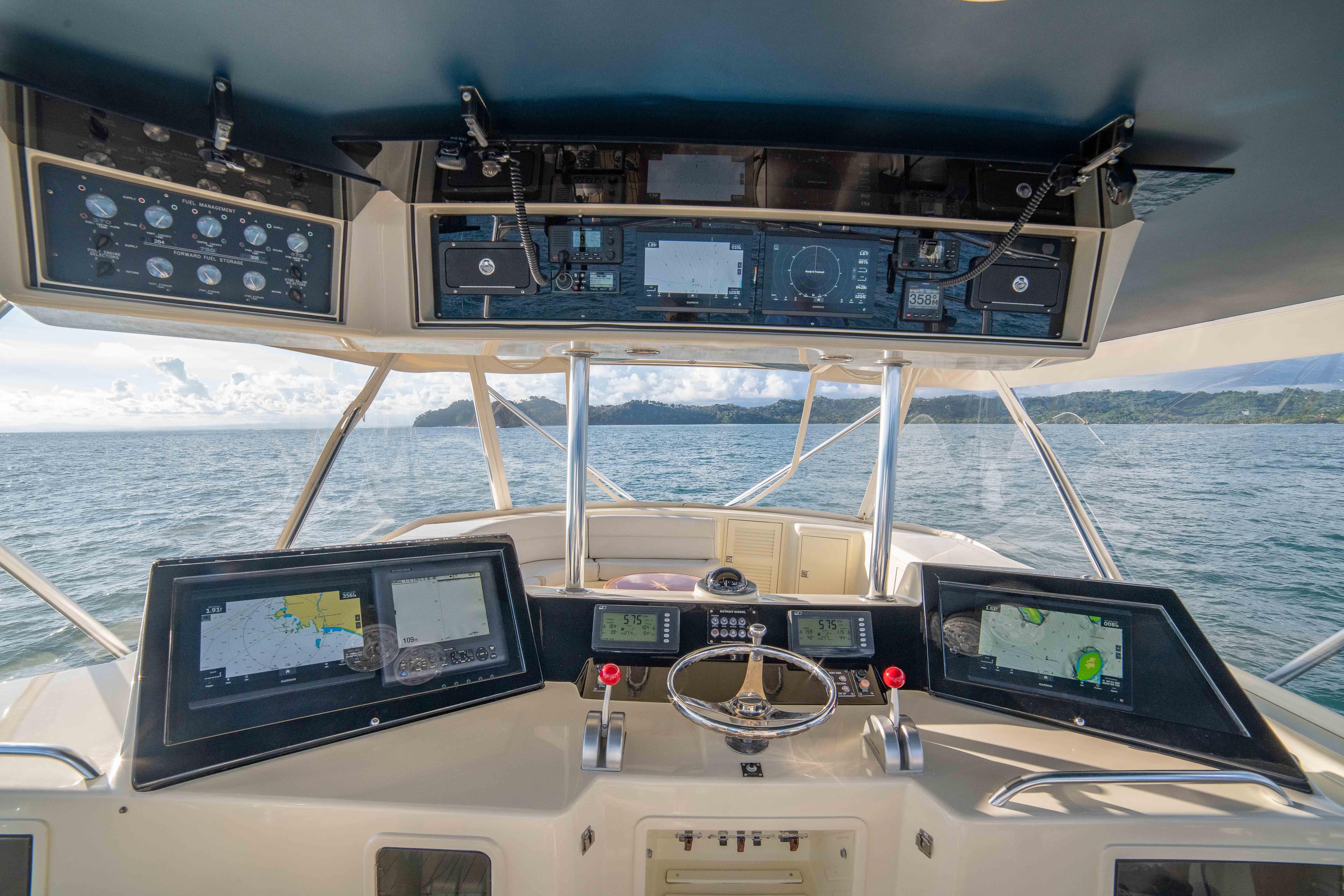 Helm of 1996 Donzi 72 Custom Convertible yacht with advanced navigation systems.