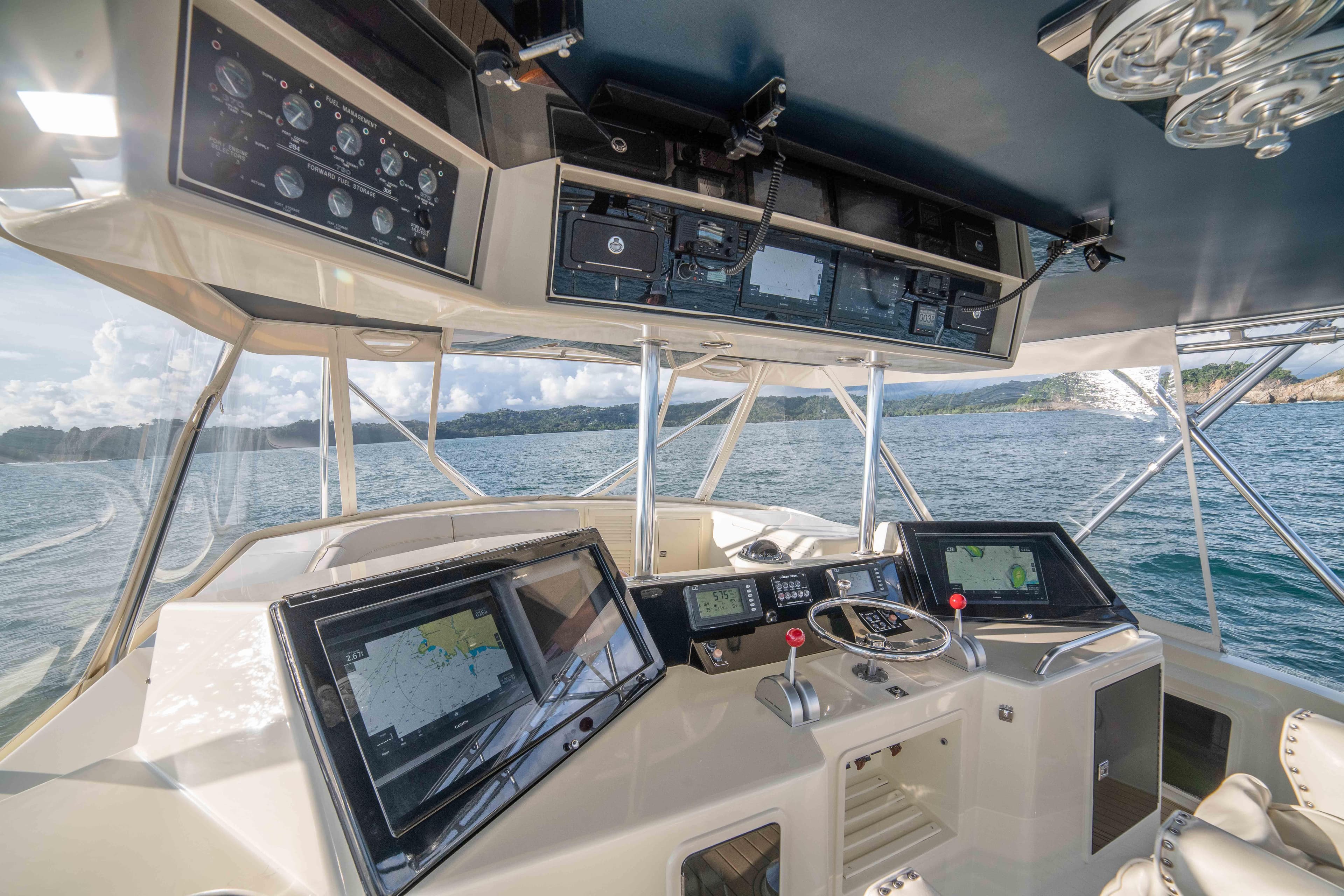 1996 Donzi 72 Custom Convertible yacht cockpit with advanced navigation systems.