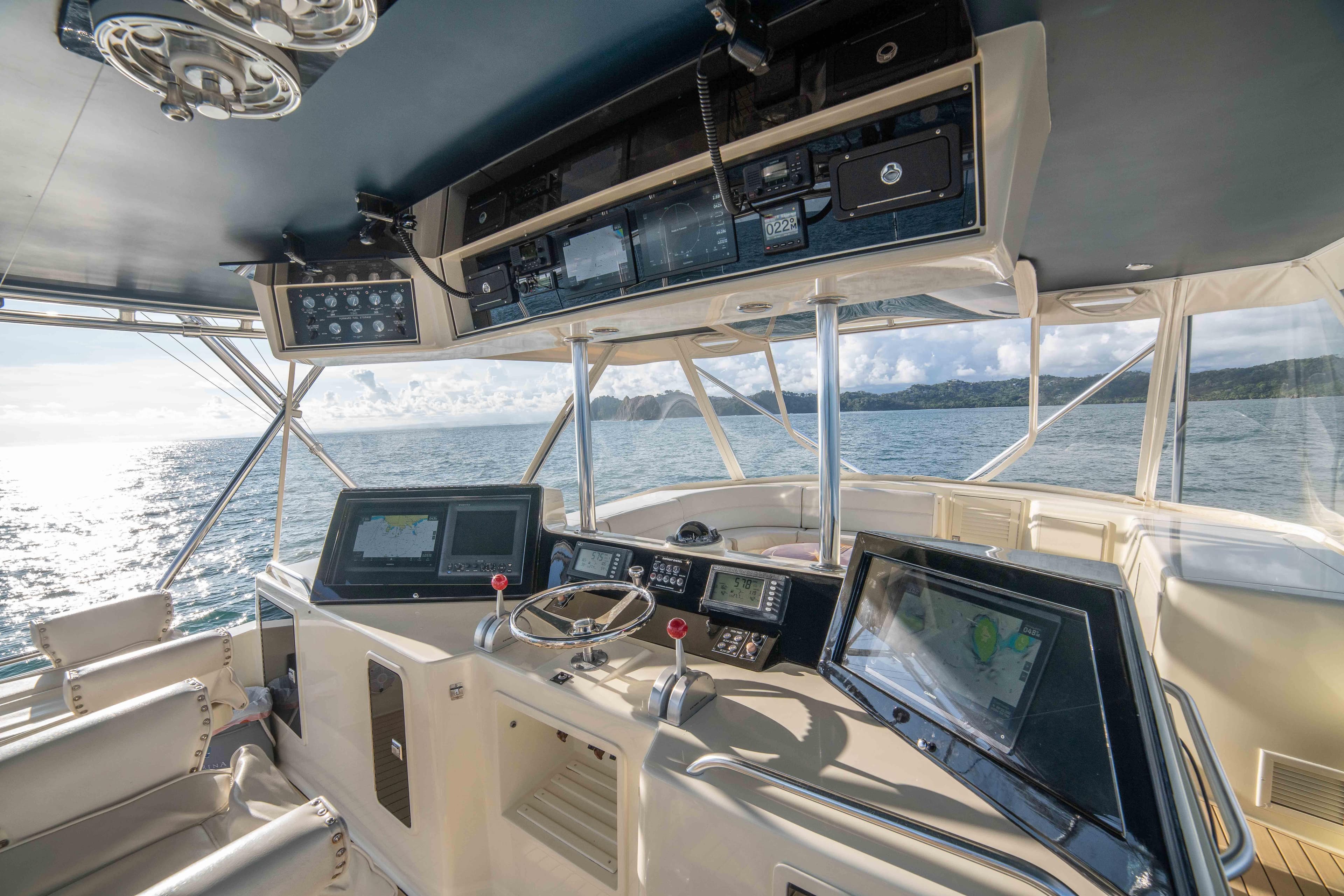 1996 Donzi 72 Custom Convertible yacht cockpit with advanced navigation systems.