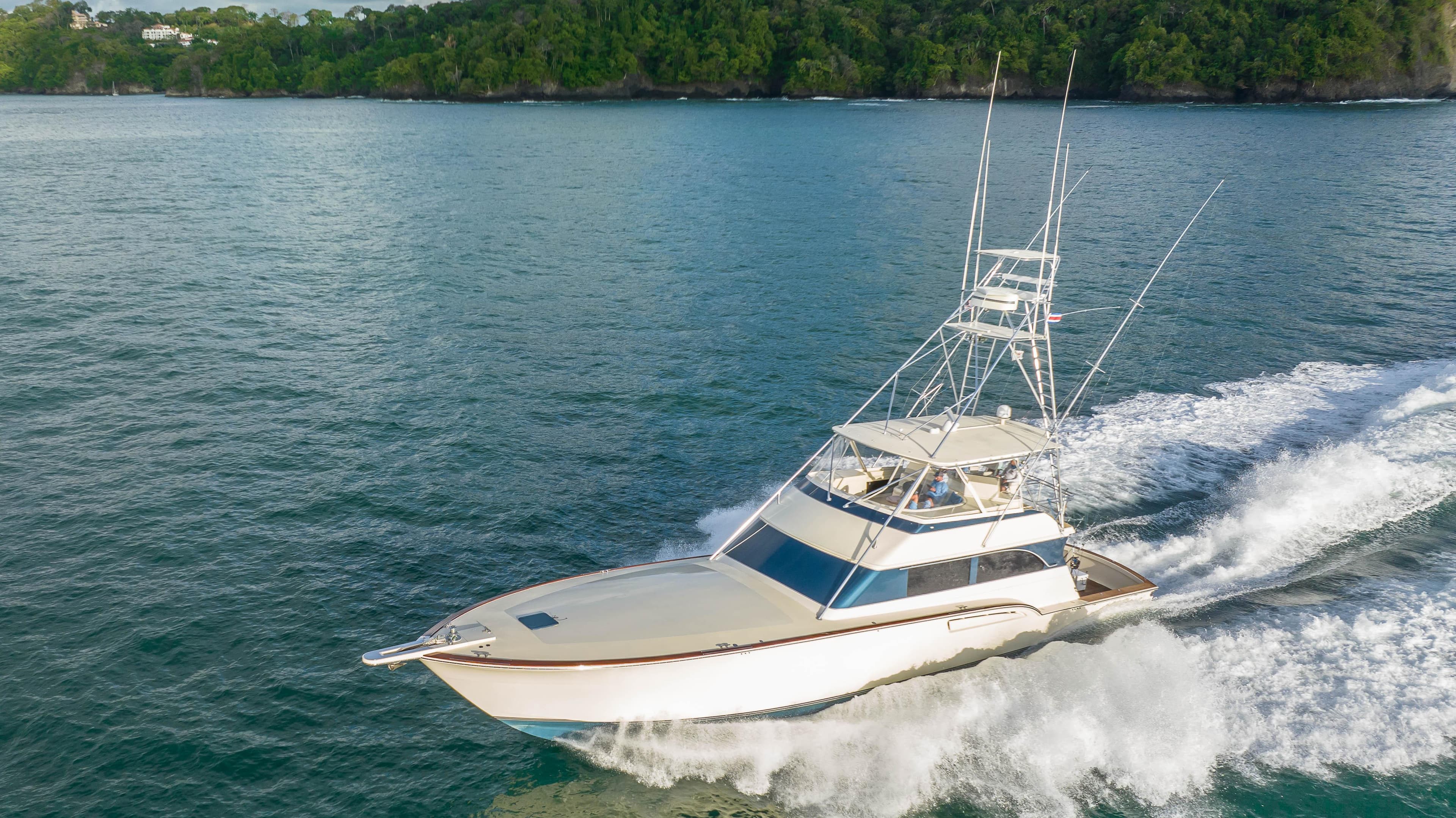 1996 Donzi 72 Custom Convertible yacht cruising on the water.