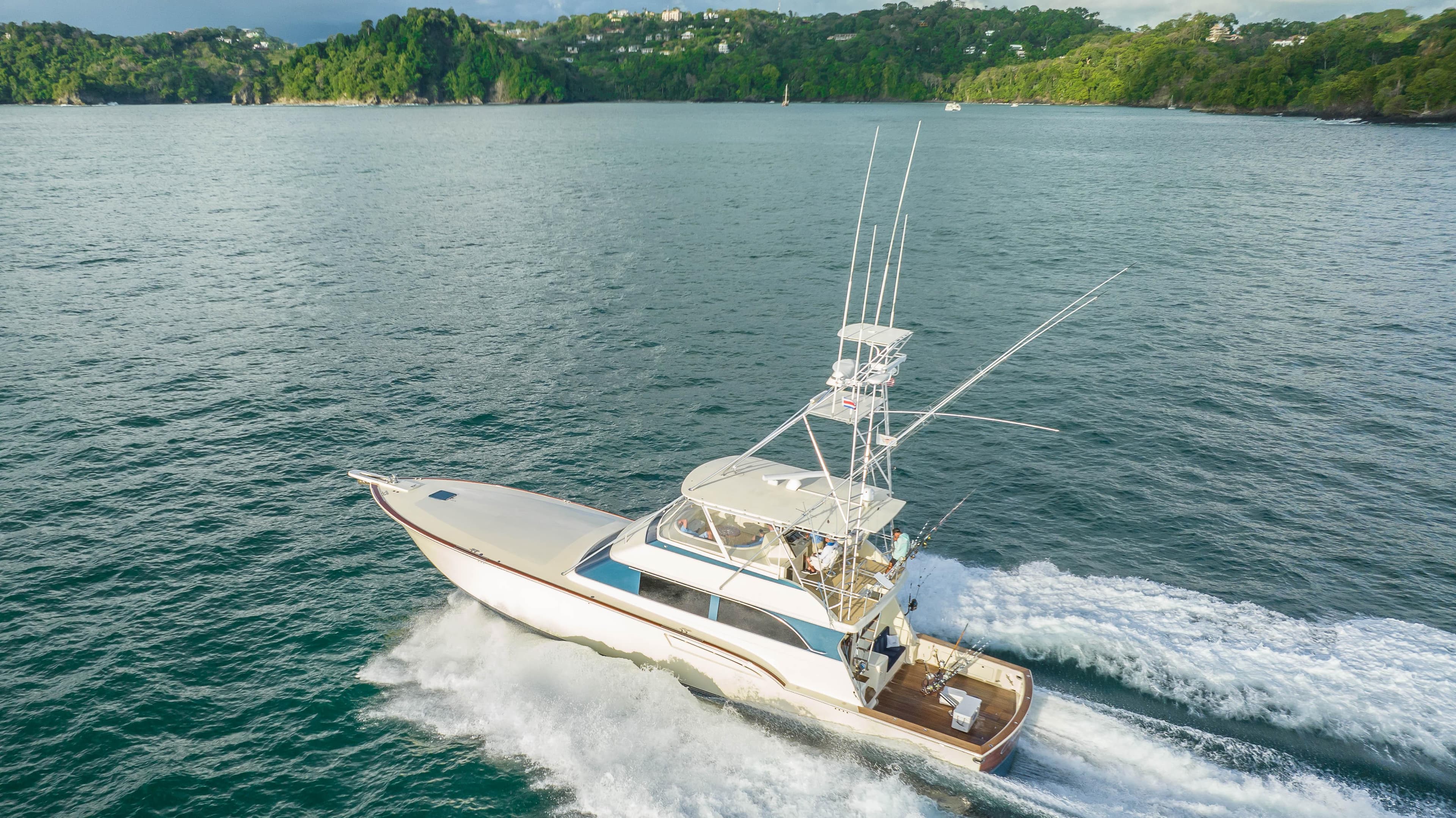 1996 Donzi 72 Custom Convertible yacht cruising on the water.