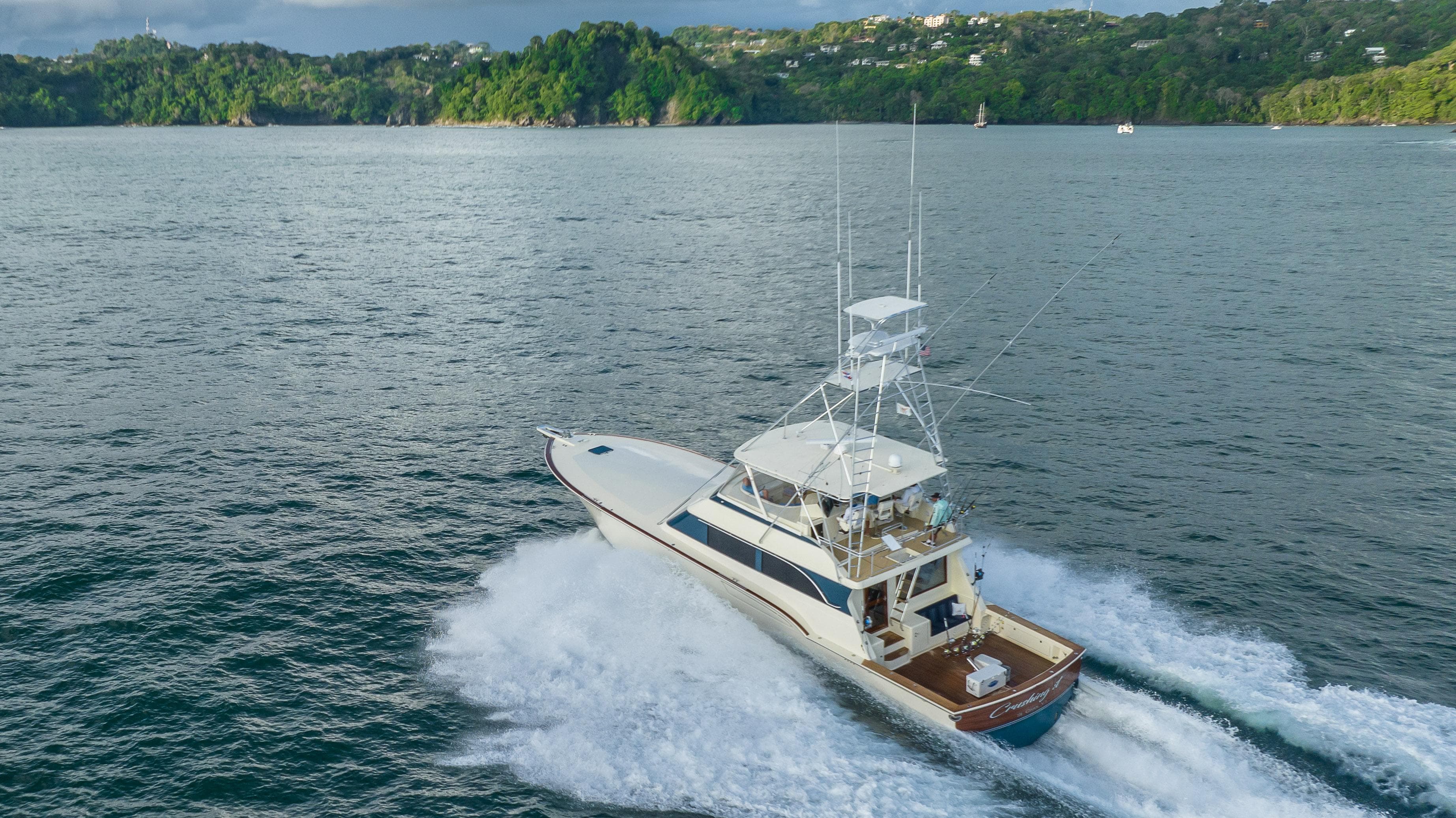 1996 Donzi 72 Custom Convertible yacht cruising on open water.