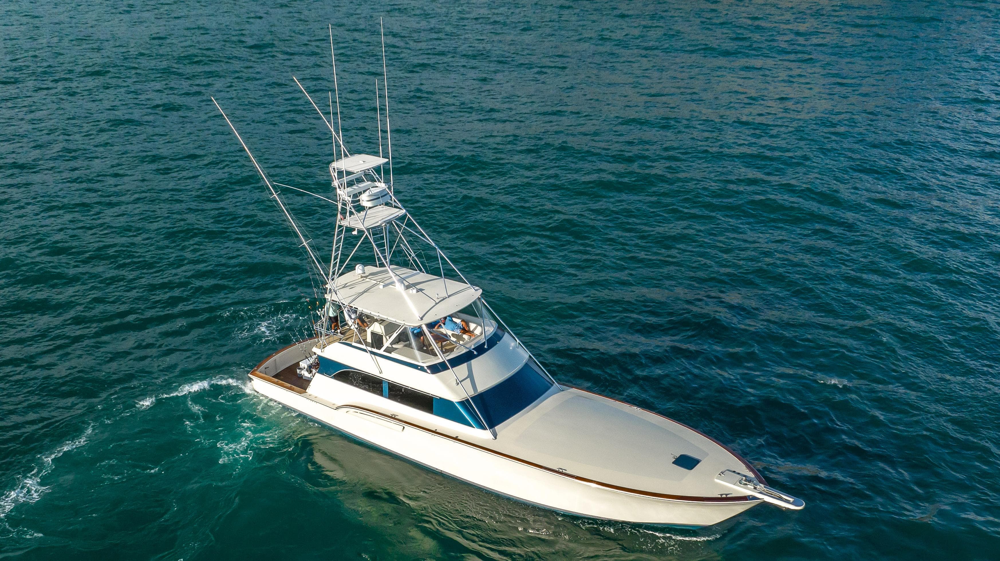 1996 Donzi 72 Custom Convertible yacht cruising on open water.