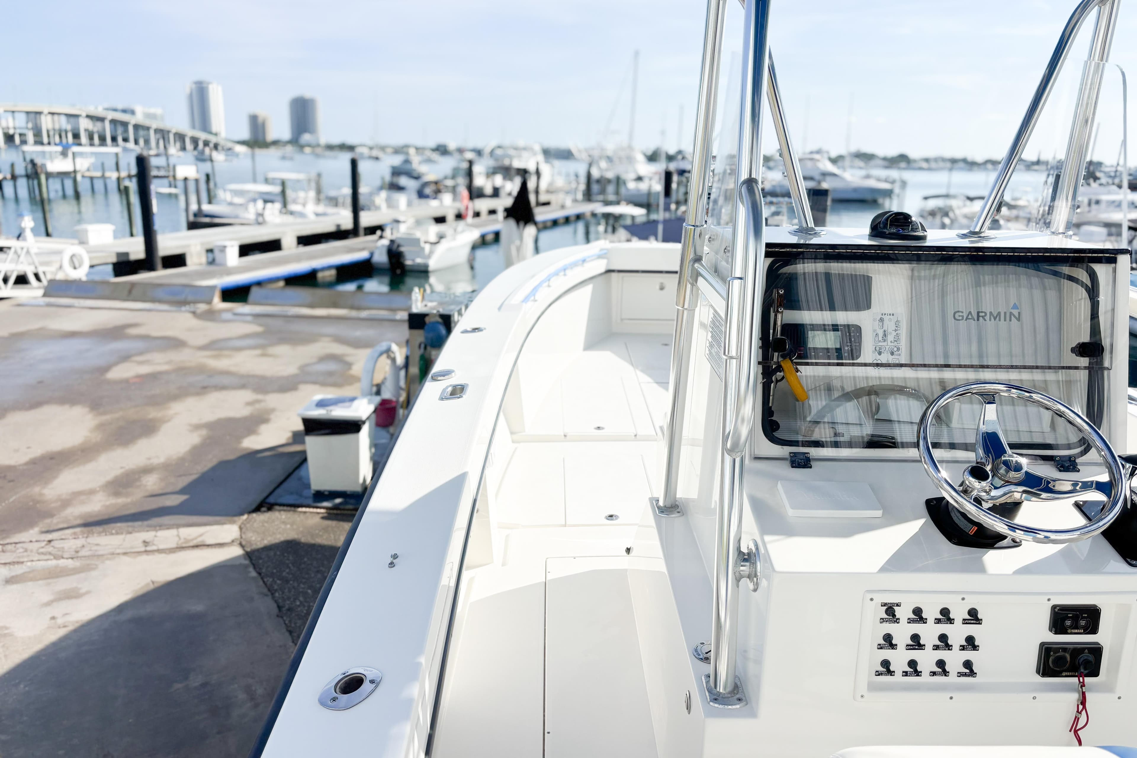 Whitewater 2016 boat at marina with Garmin navigation system, docked near waterfront.