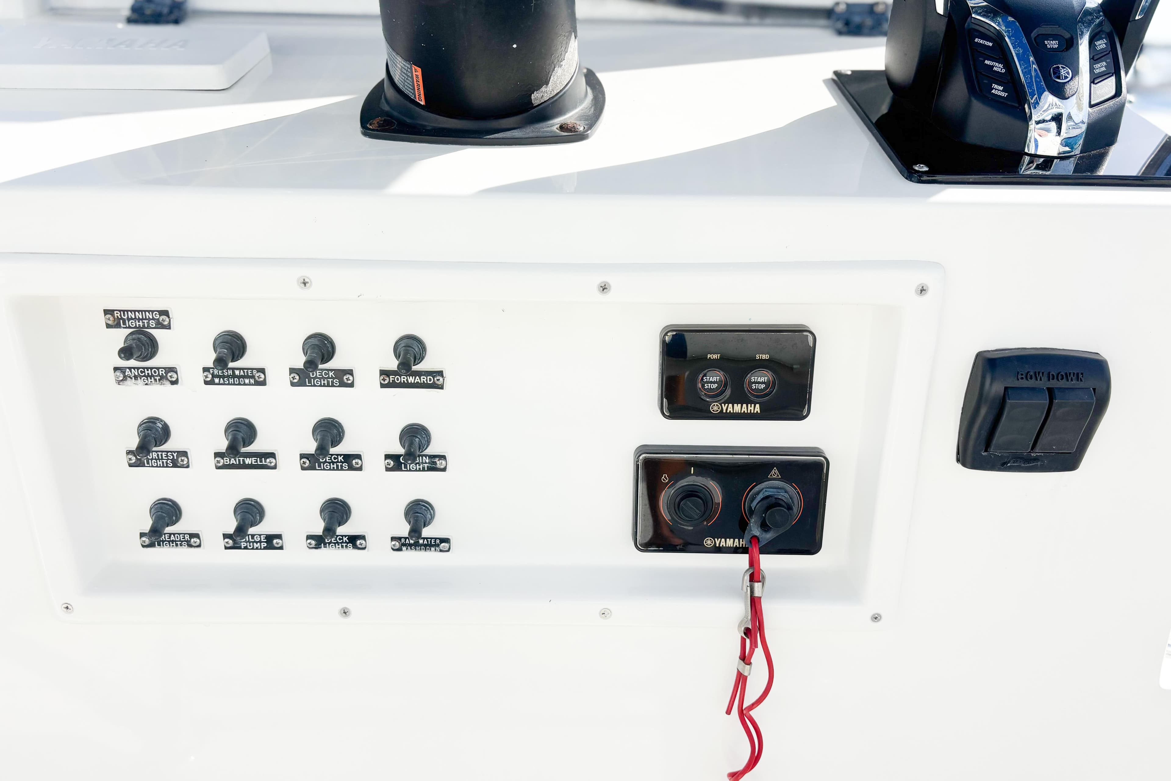 Control panel of a 2016 Whitewater boat featuring Yamaha switches and various labeled toggles.