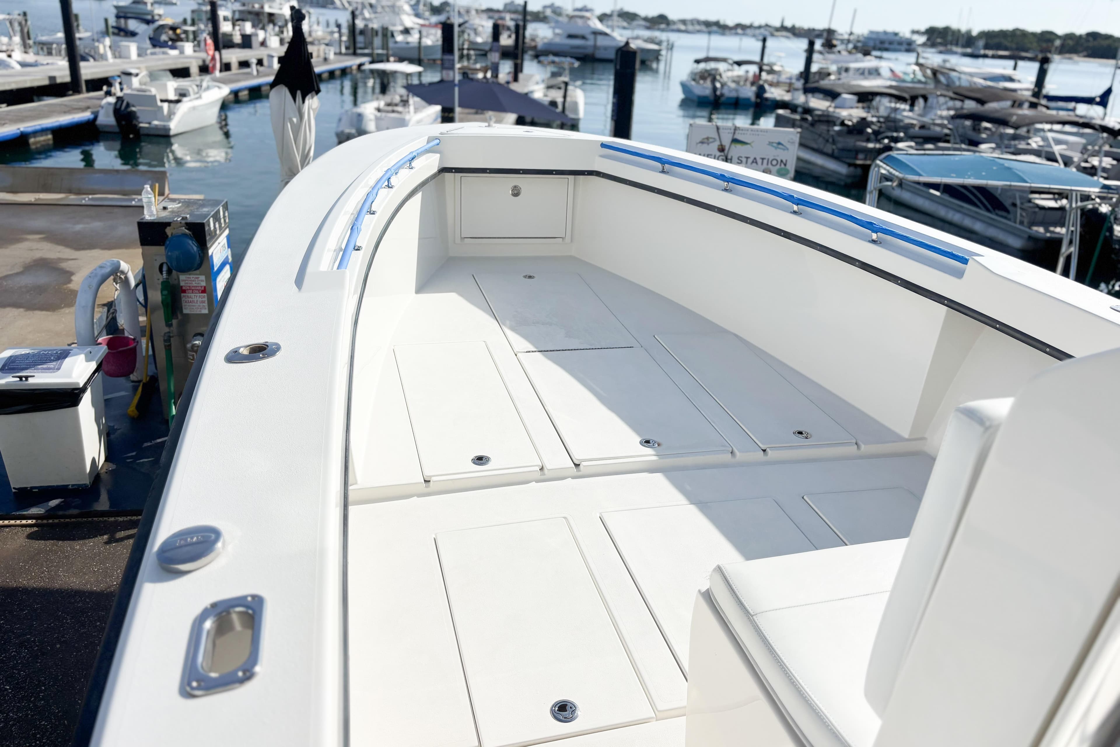 2016 Whitewater boat deck at marina, showcasing spacious layout and sleek design.