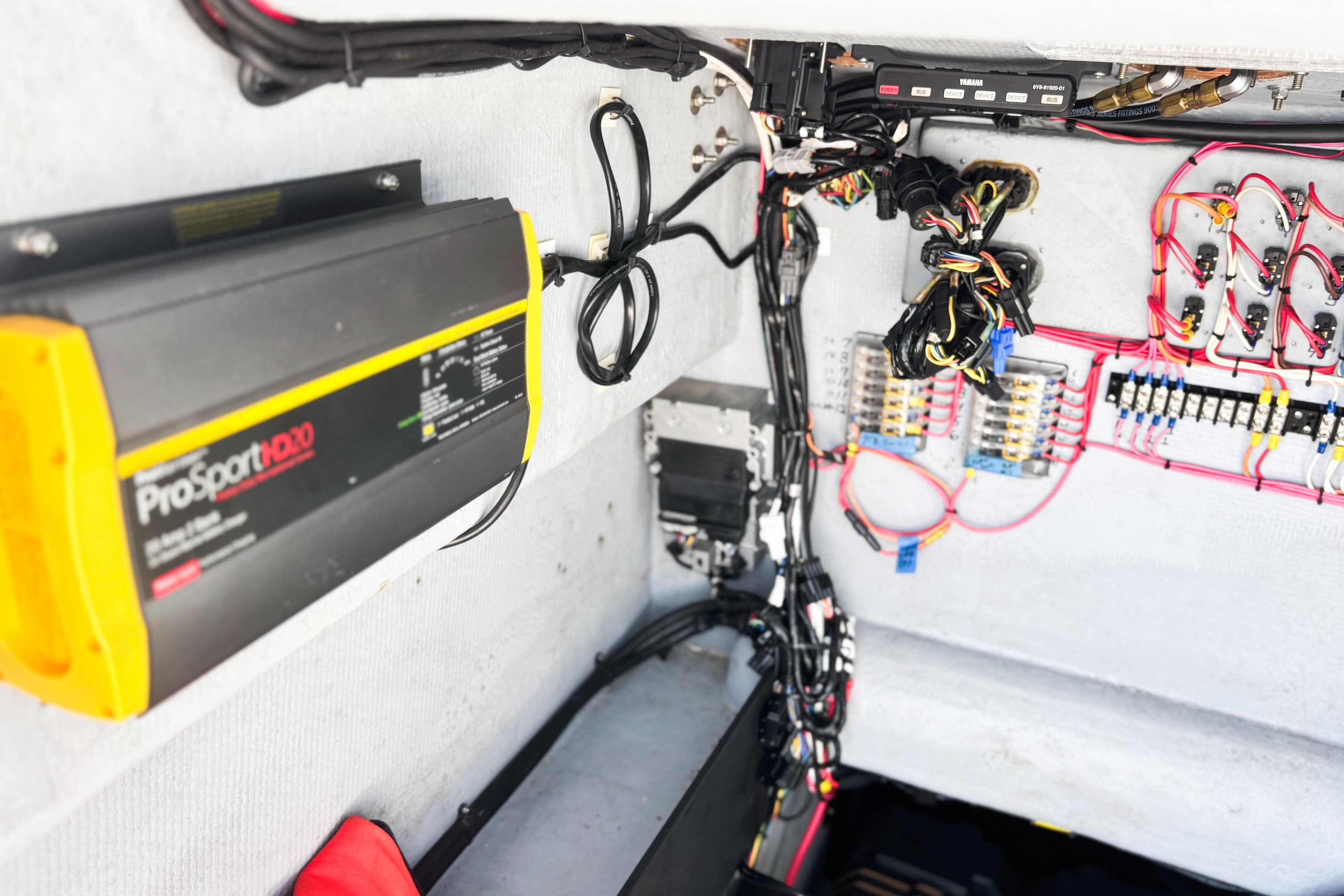 Electrical system setup in a 2016 Whitewater boat, featuring ProSportHD20 charger and wiring.