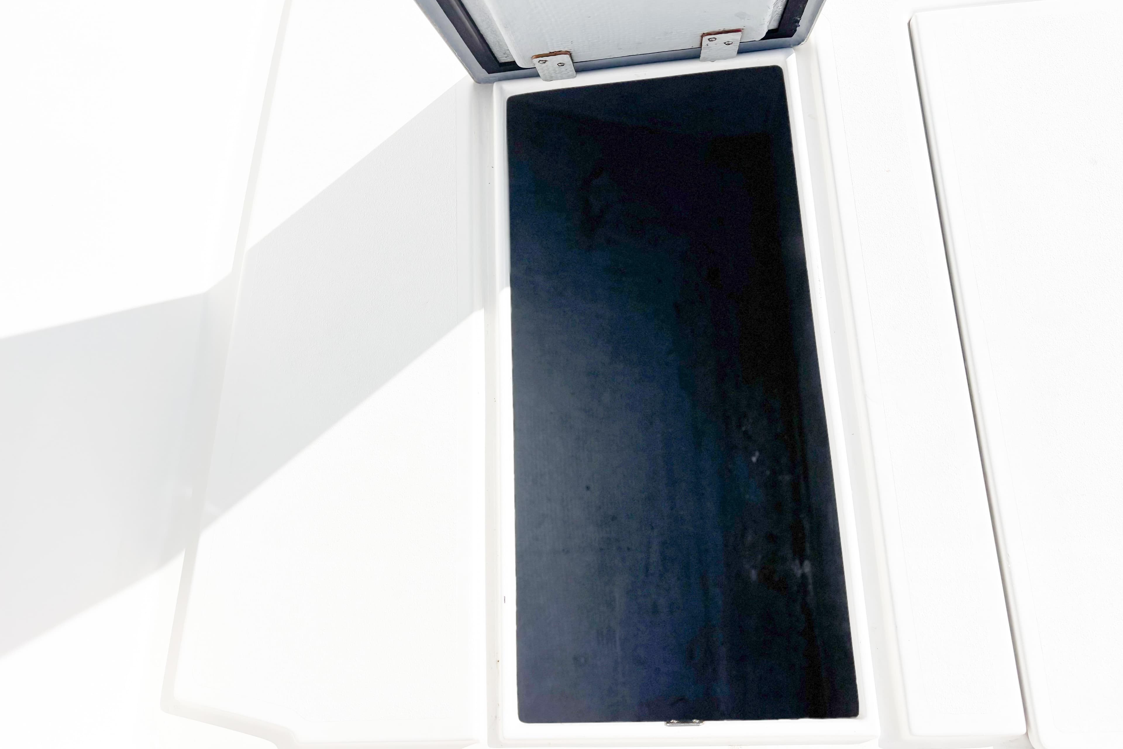 Open storage compartment on a 2016 Whitewater boat, showing interior space.