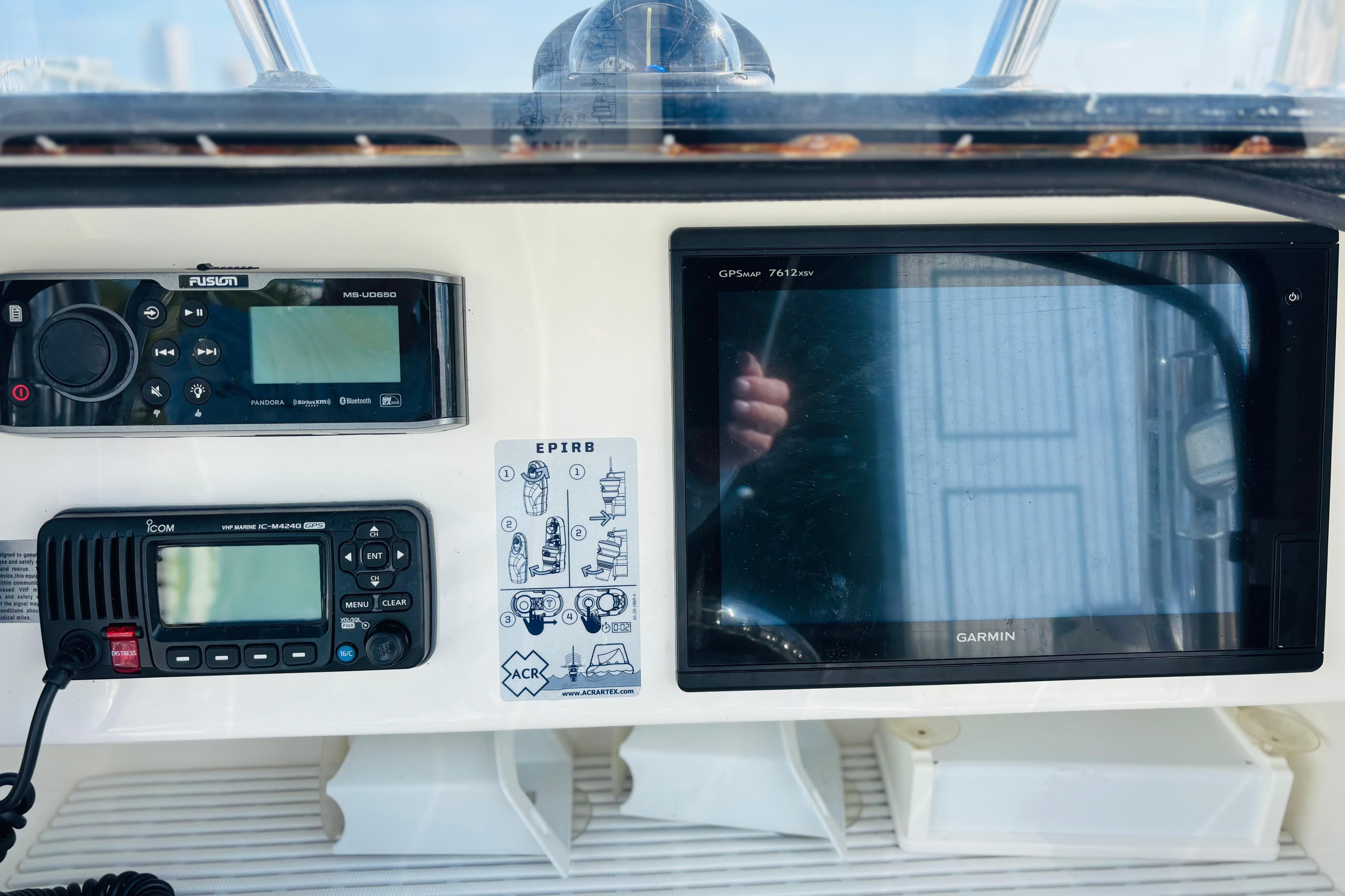 Boat dashboard with Garmin GPS, Fusion stereo, and Icom VHF radio, Whitewater 2016 model.