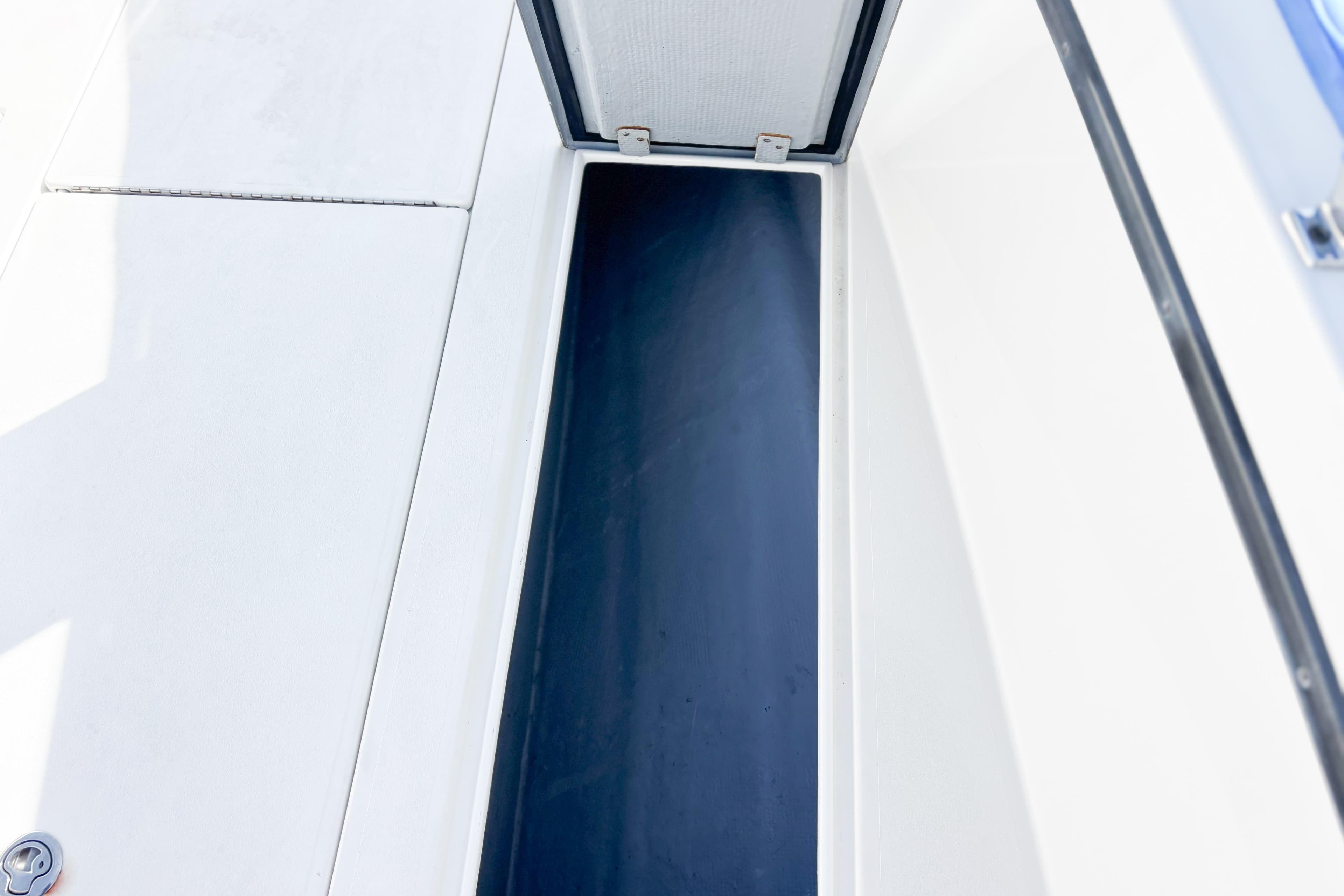 Open storage compartment on a 2016 Whitewater boat, featuring a sleek design.