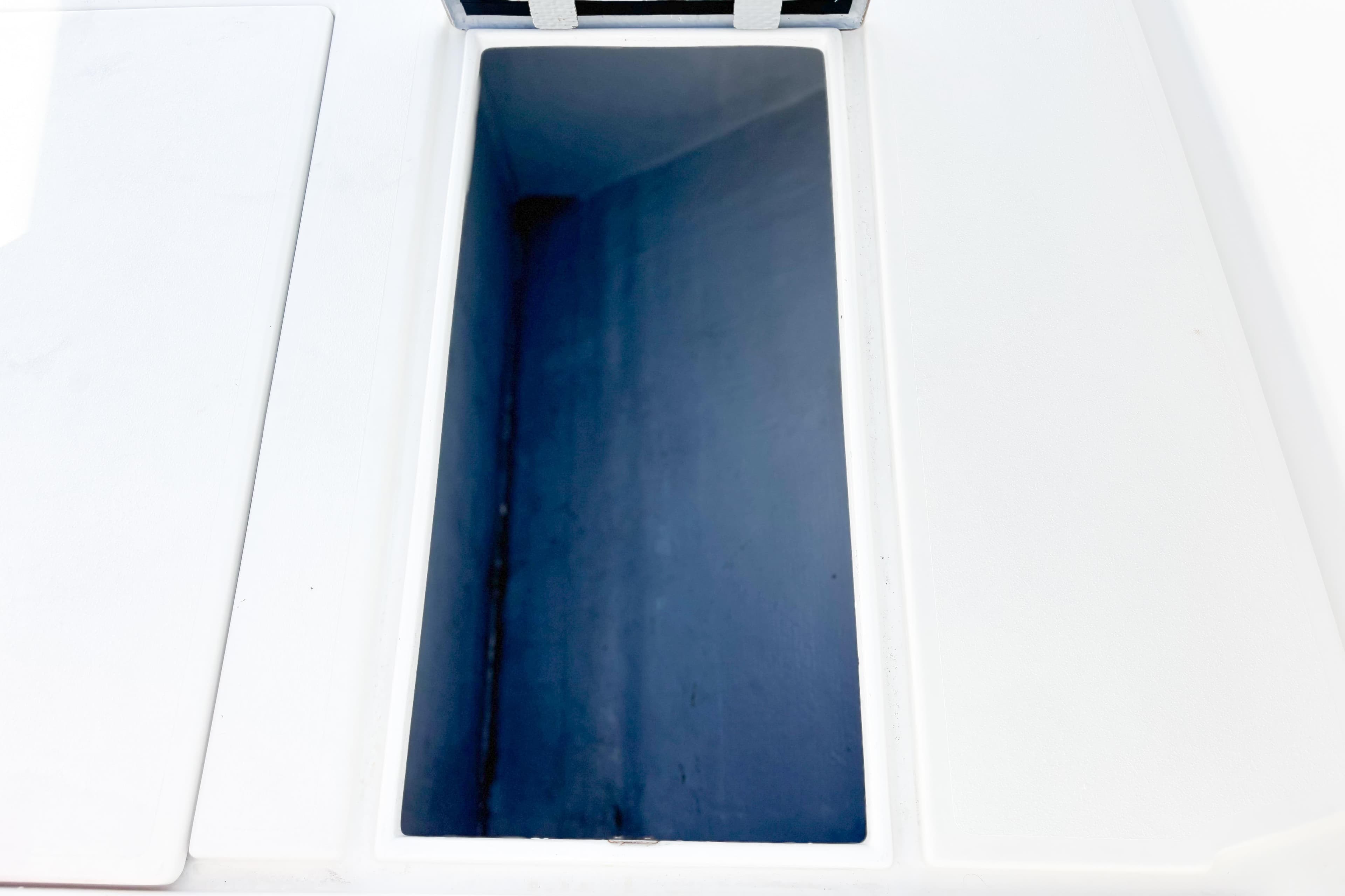 Whitewater 2016 boat storage compartment with open lid, showcasing interior space.