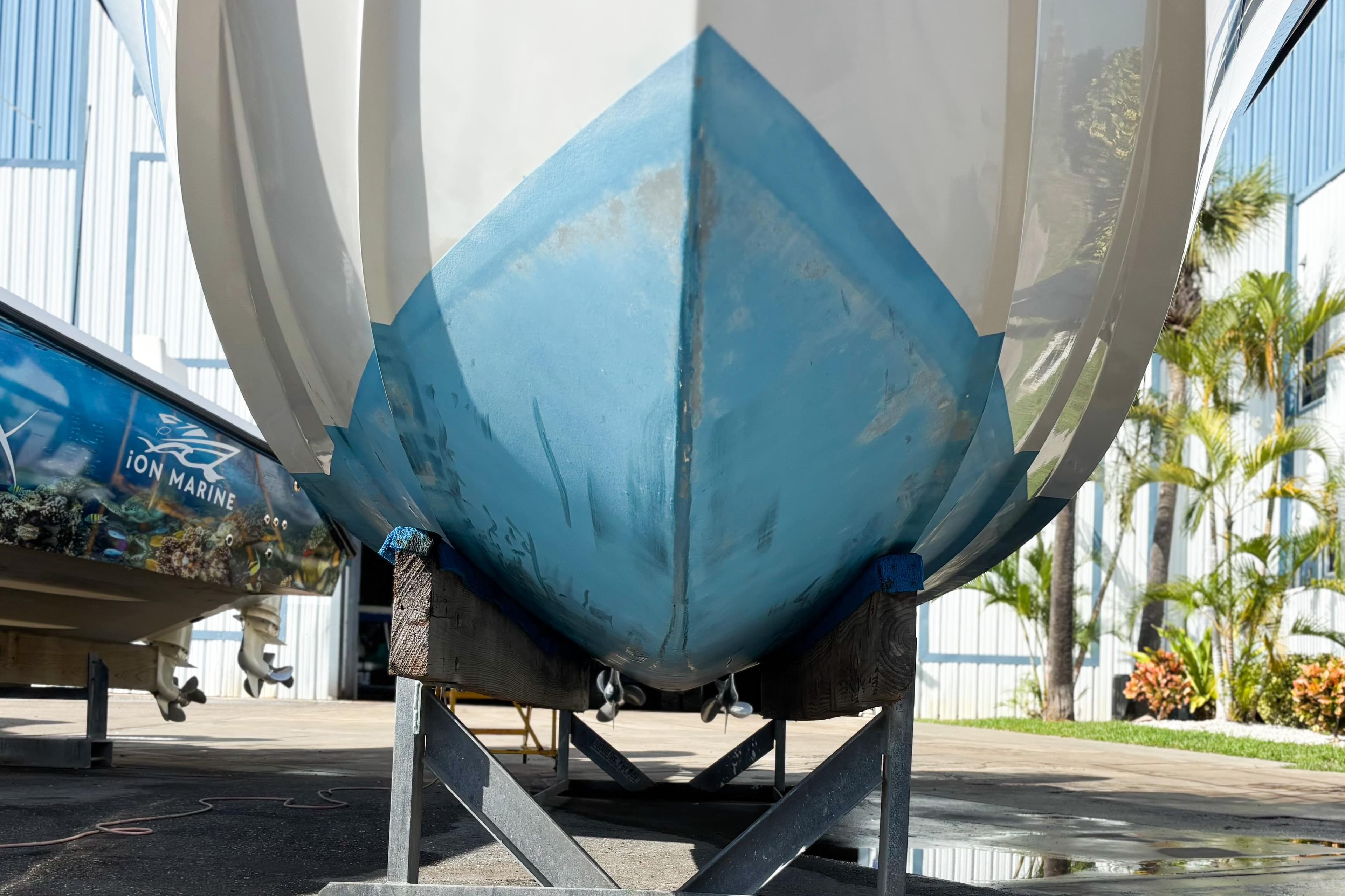 2016 Whitewater boat hull on trailer, outdoor setting with palm trees.
