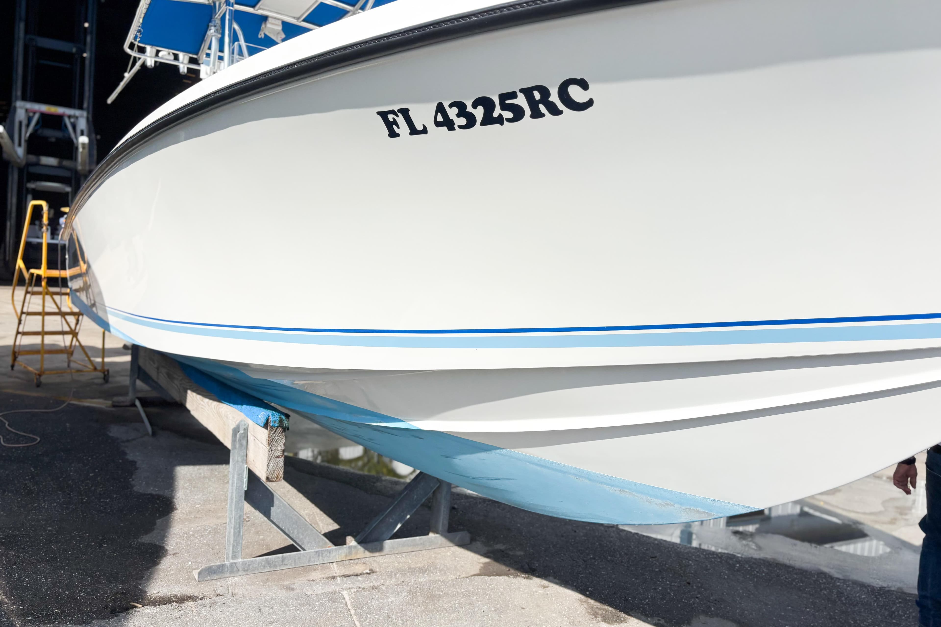 Whitewater 2016 boat on stand, displaying registration FL 4325RC.