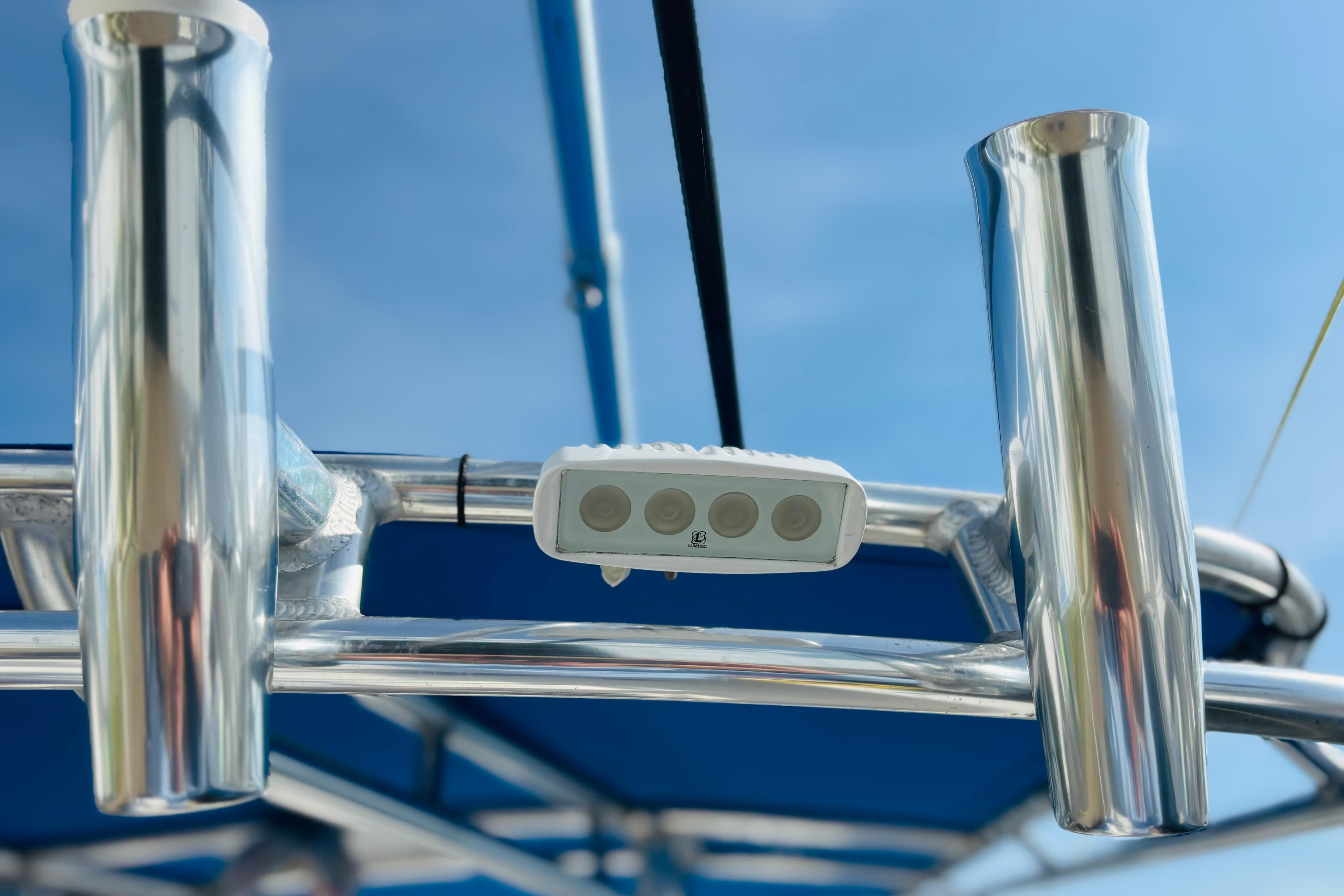 Stainless steel boat frame with mounted light, under clear blue sky, Whitewater 2016.