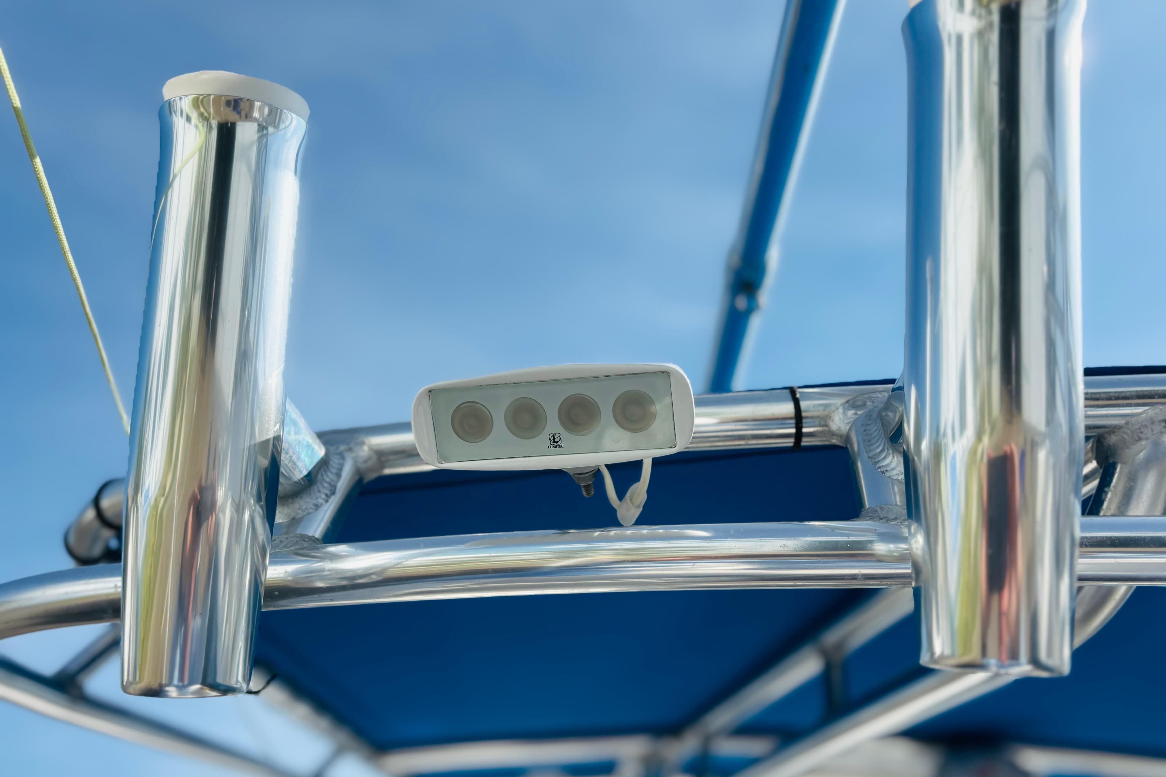 Close-up of a 2016 Whitewater boat's metal frame and mounted equipment under a clear sky.