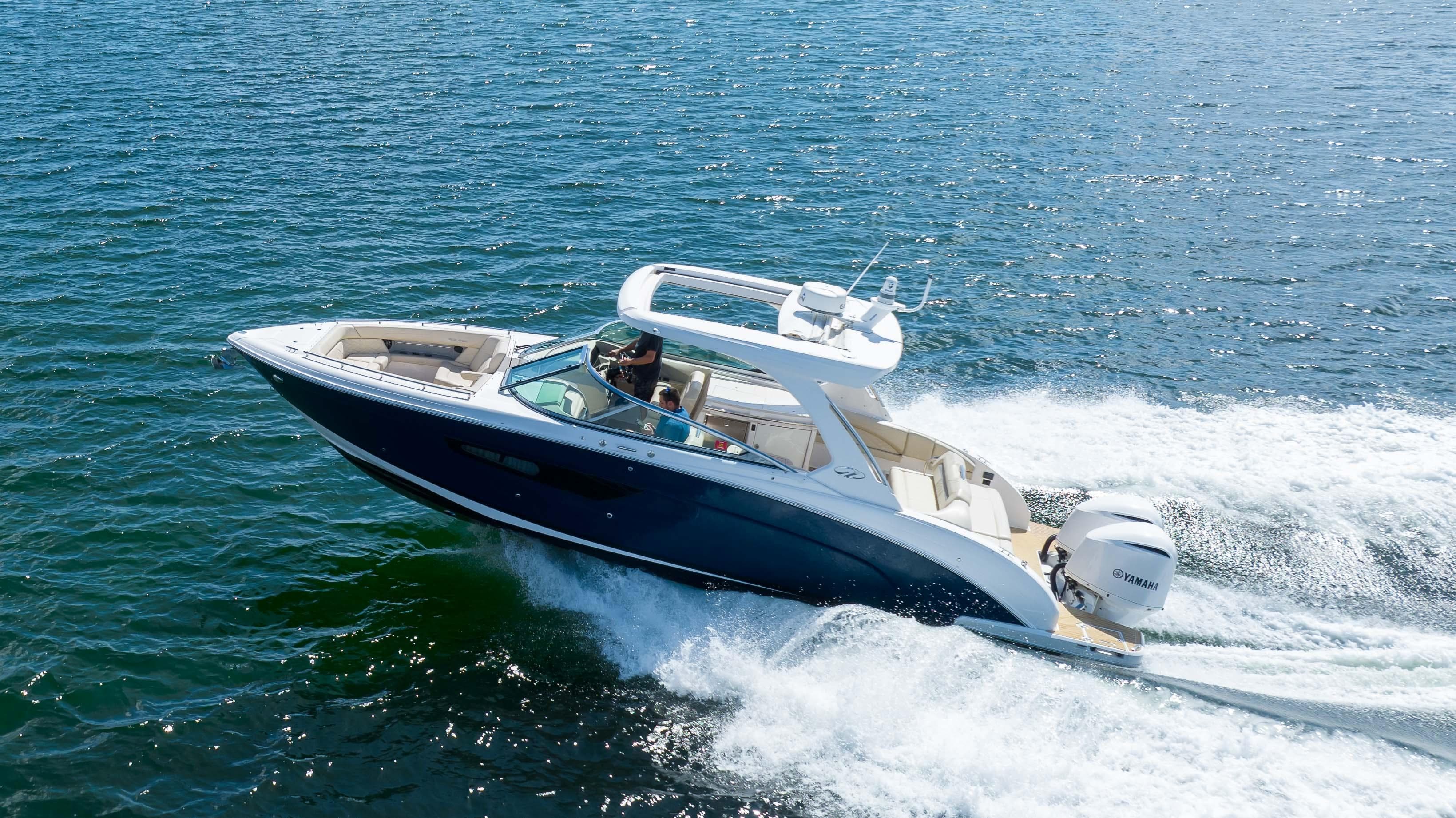 2019 Regal 33 OBX boat cruising on open water.
