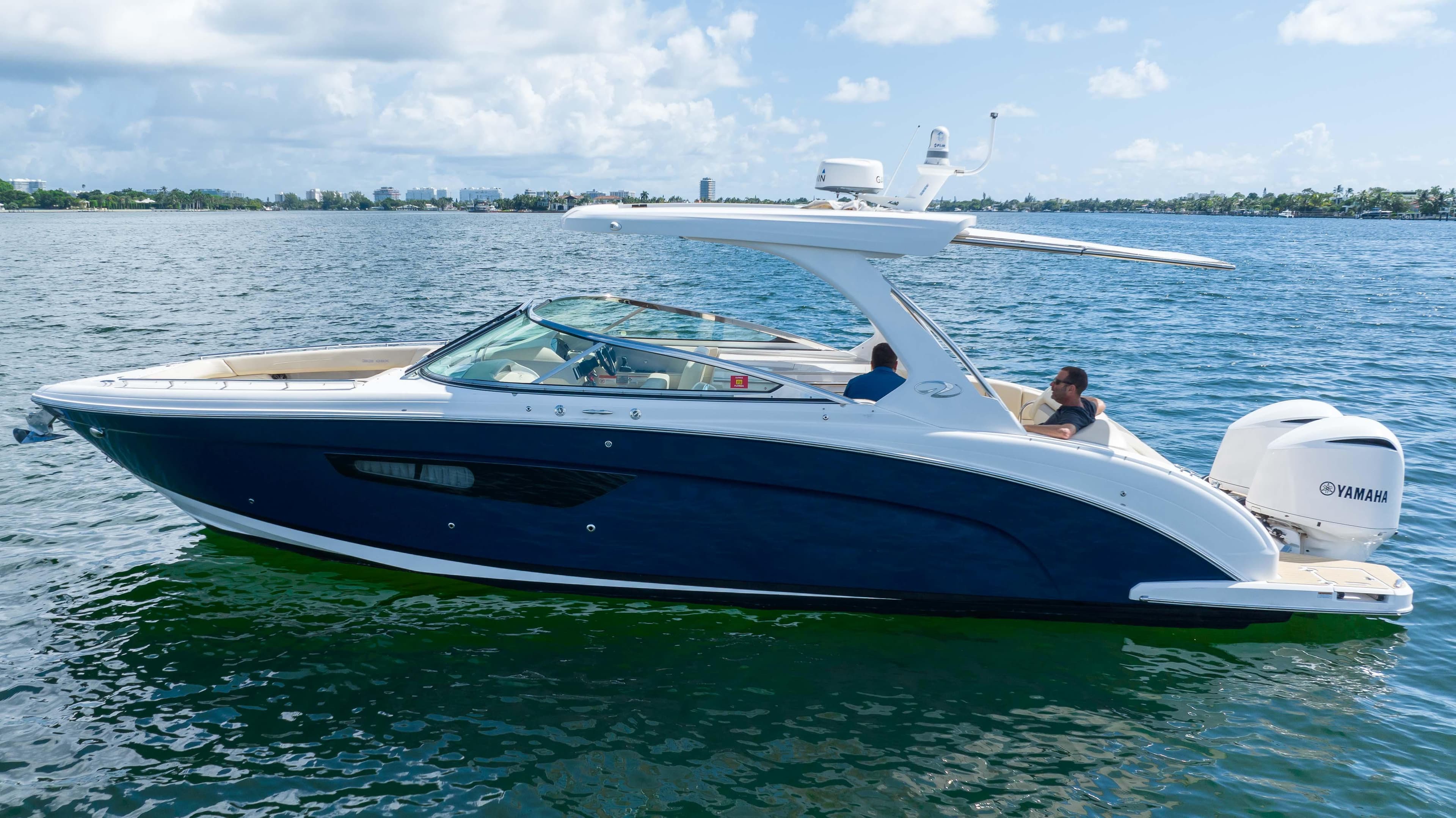 2019 Regal 33 OBX boat cruising on a sunny day.