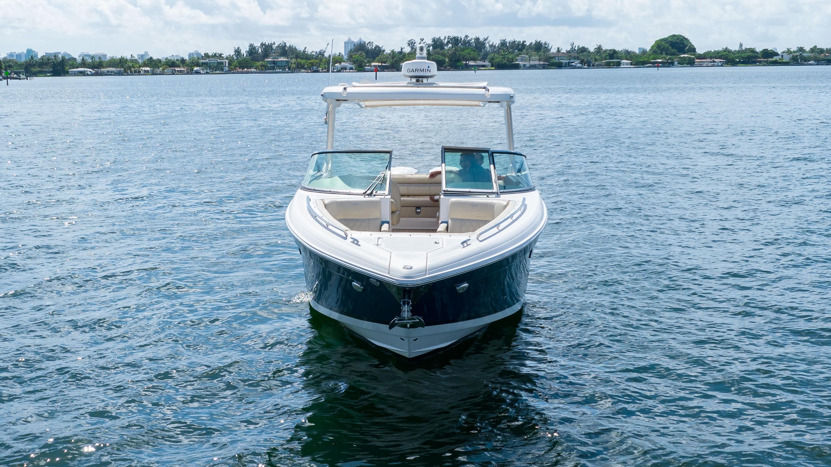 2019 Regal 33 OBX boat on calm water, front view.