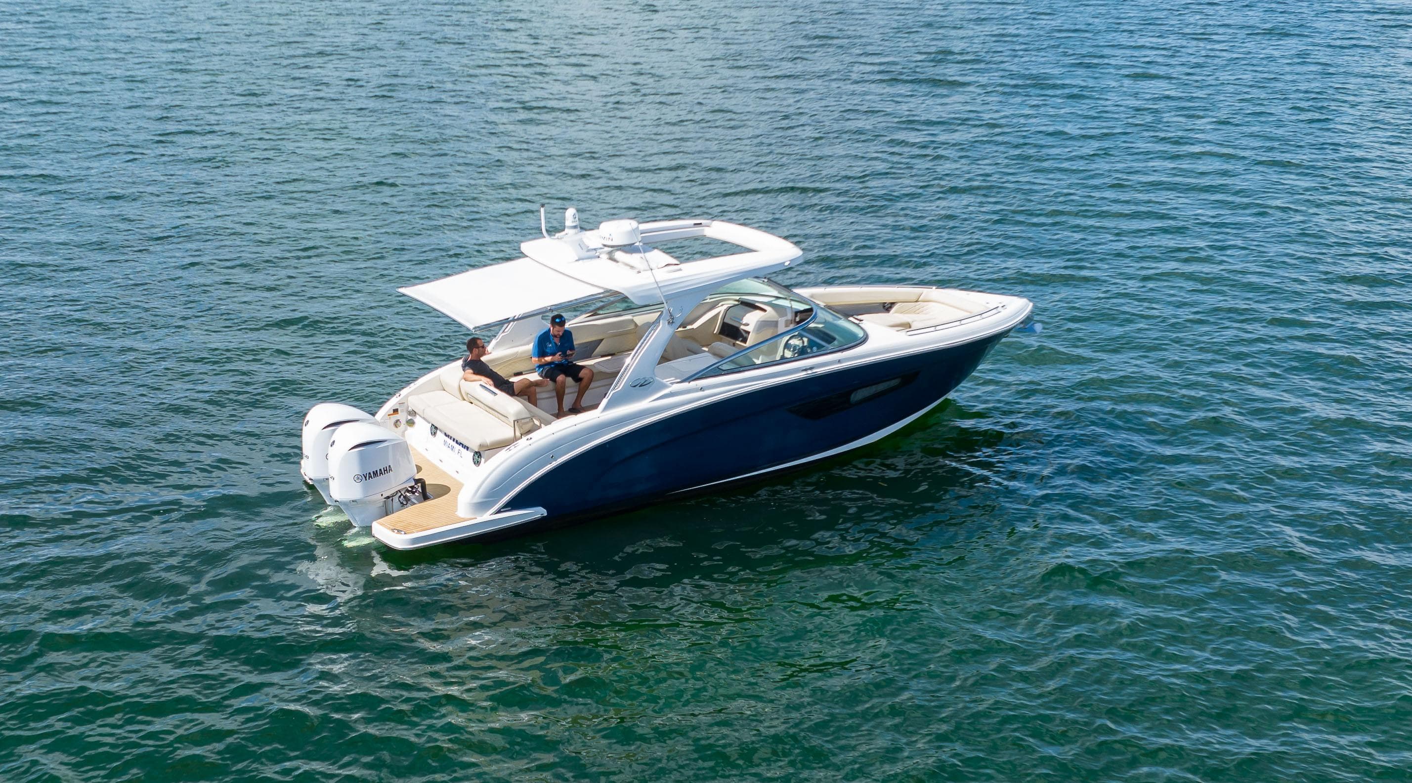 2019 Regal 33 OBX boat cruising on open water.