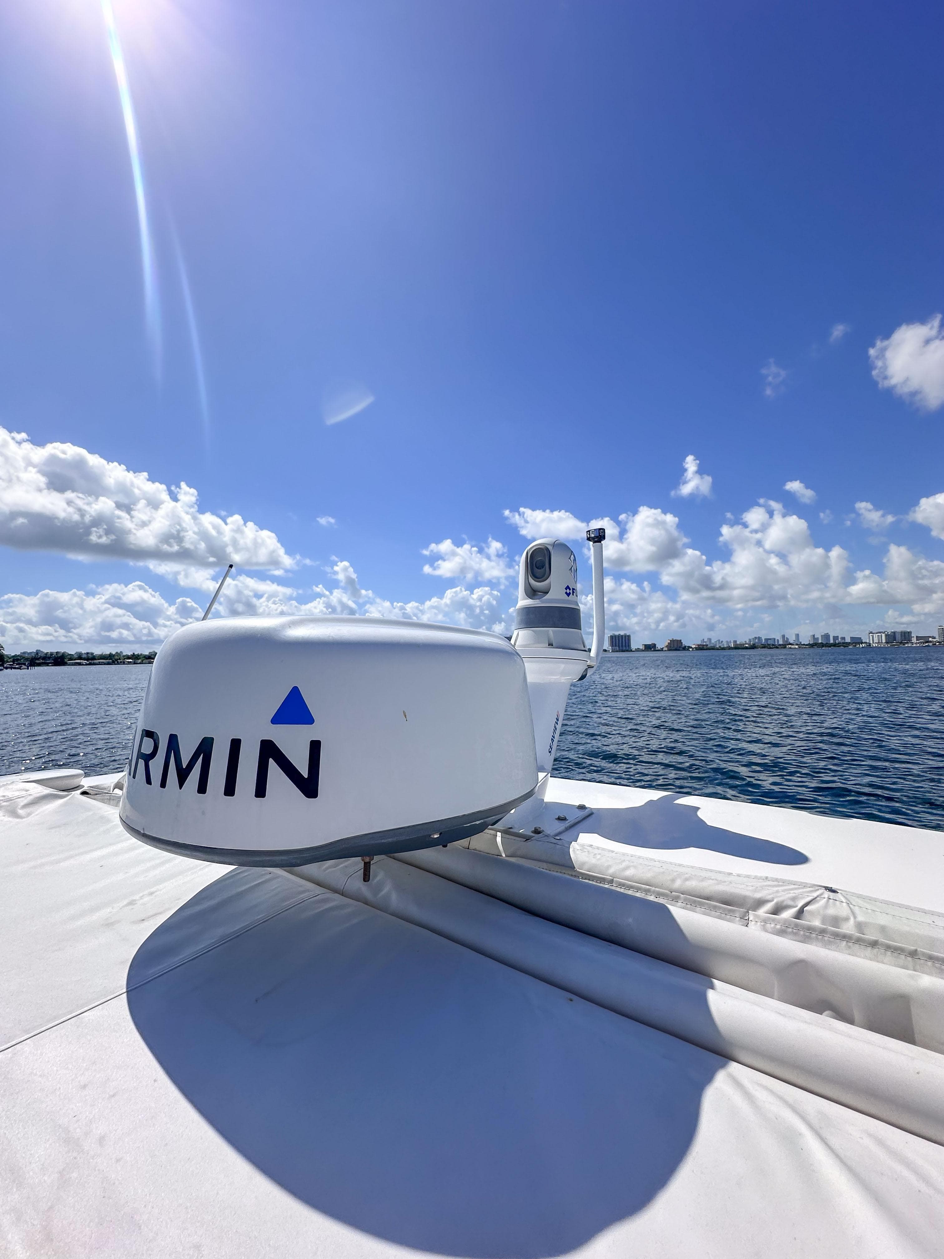 2019 Regal 33 OBX boat with Garmin radar on a sunny day at sea.