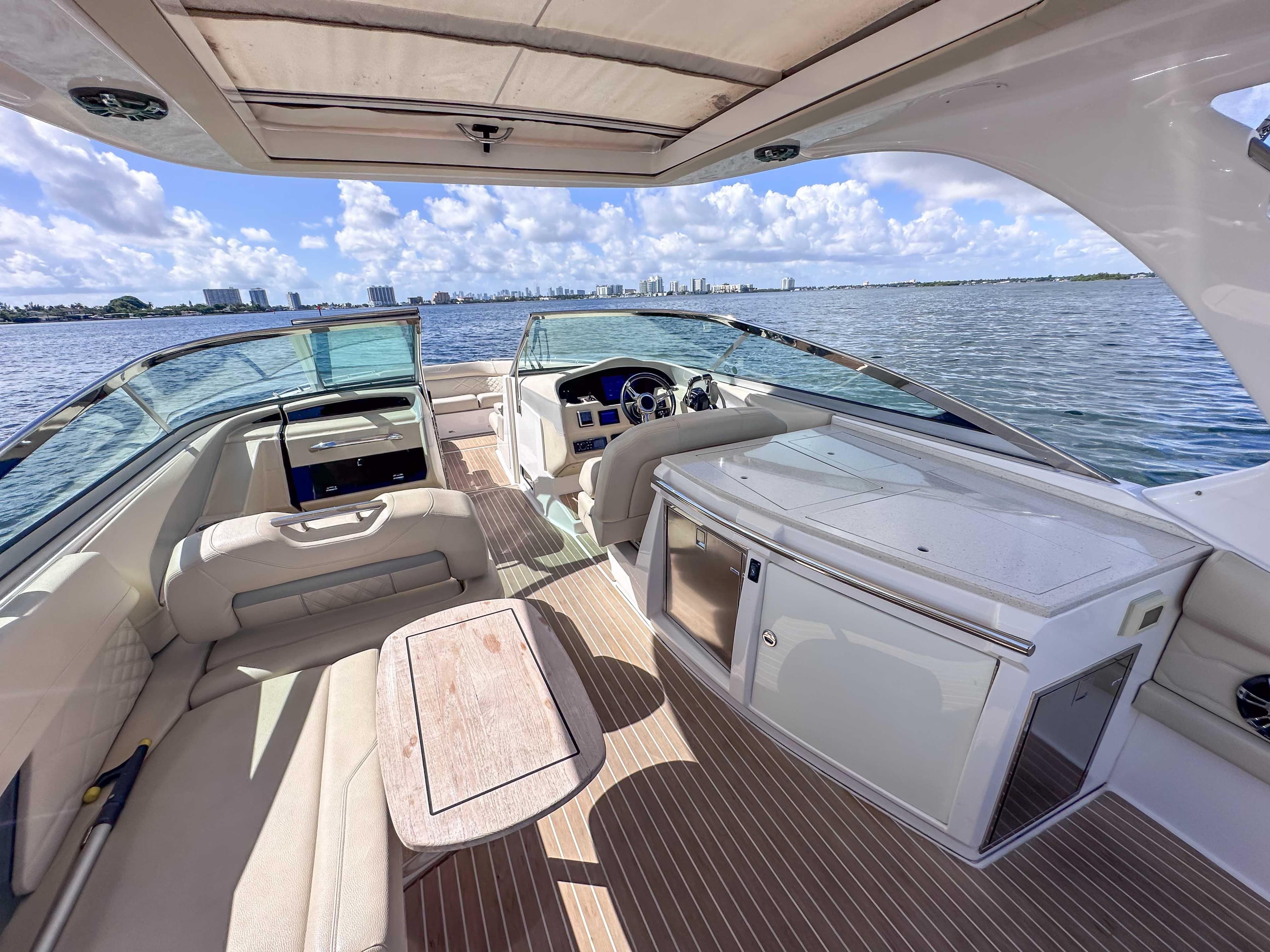 2019 Regal 33 OBX boat interior with seating, table, and water view.