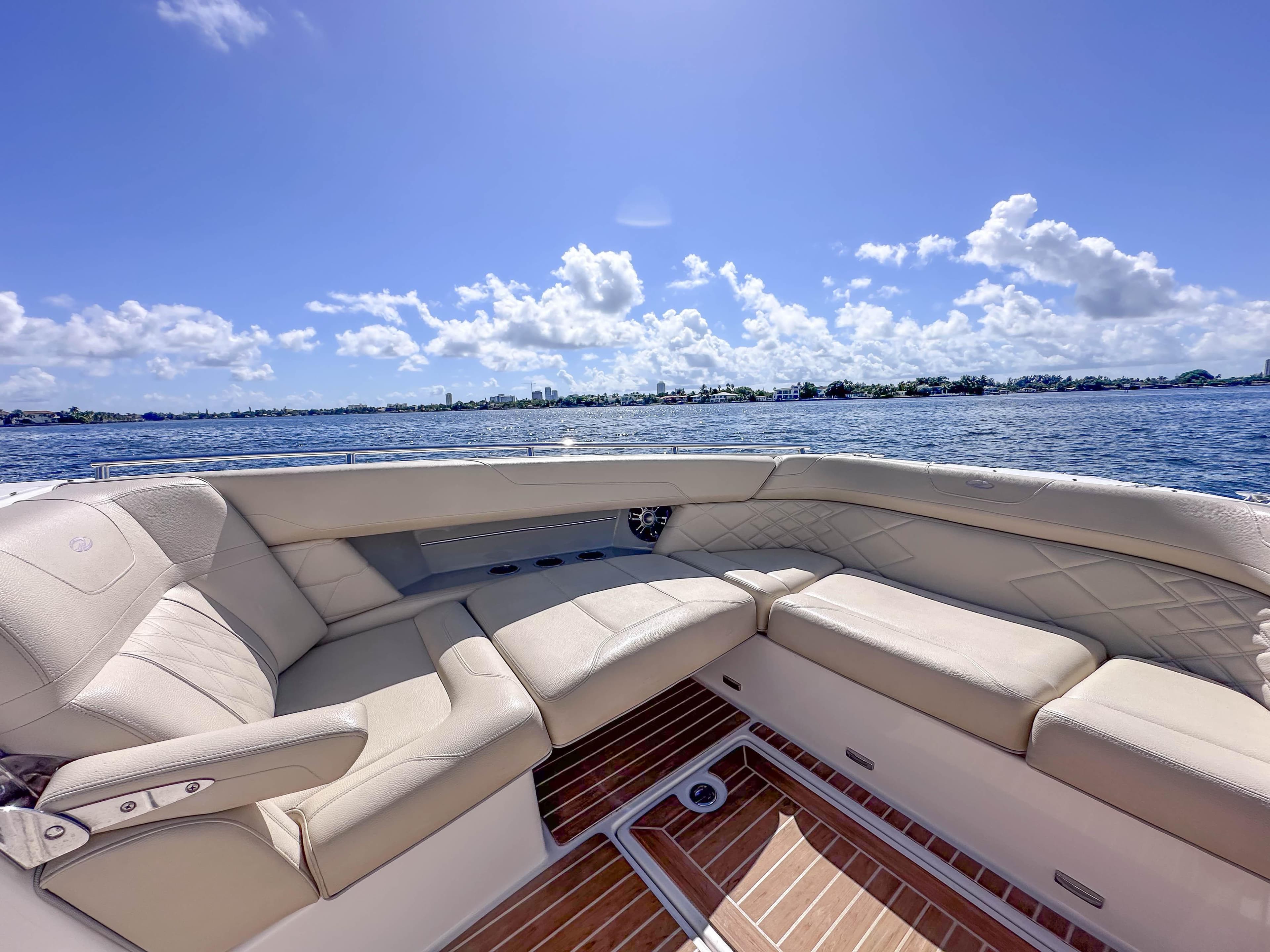 Luxurious seating on 2019 Regal 33 OBX boat with scenic ocean view.